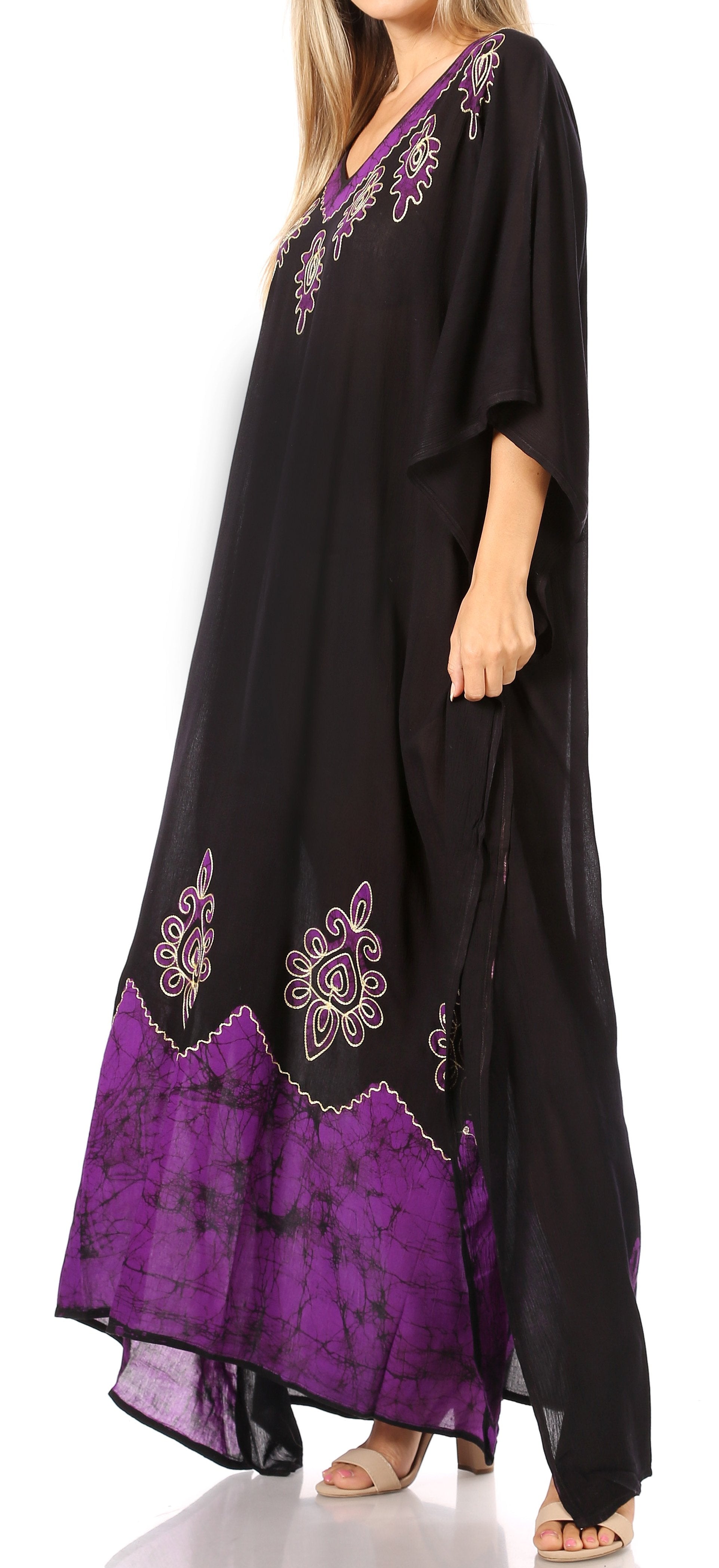 Black and purple dress with floral embroidery on a white background