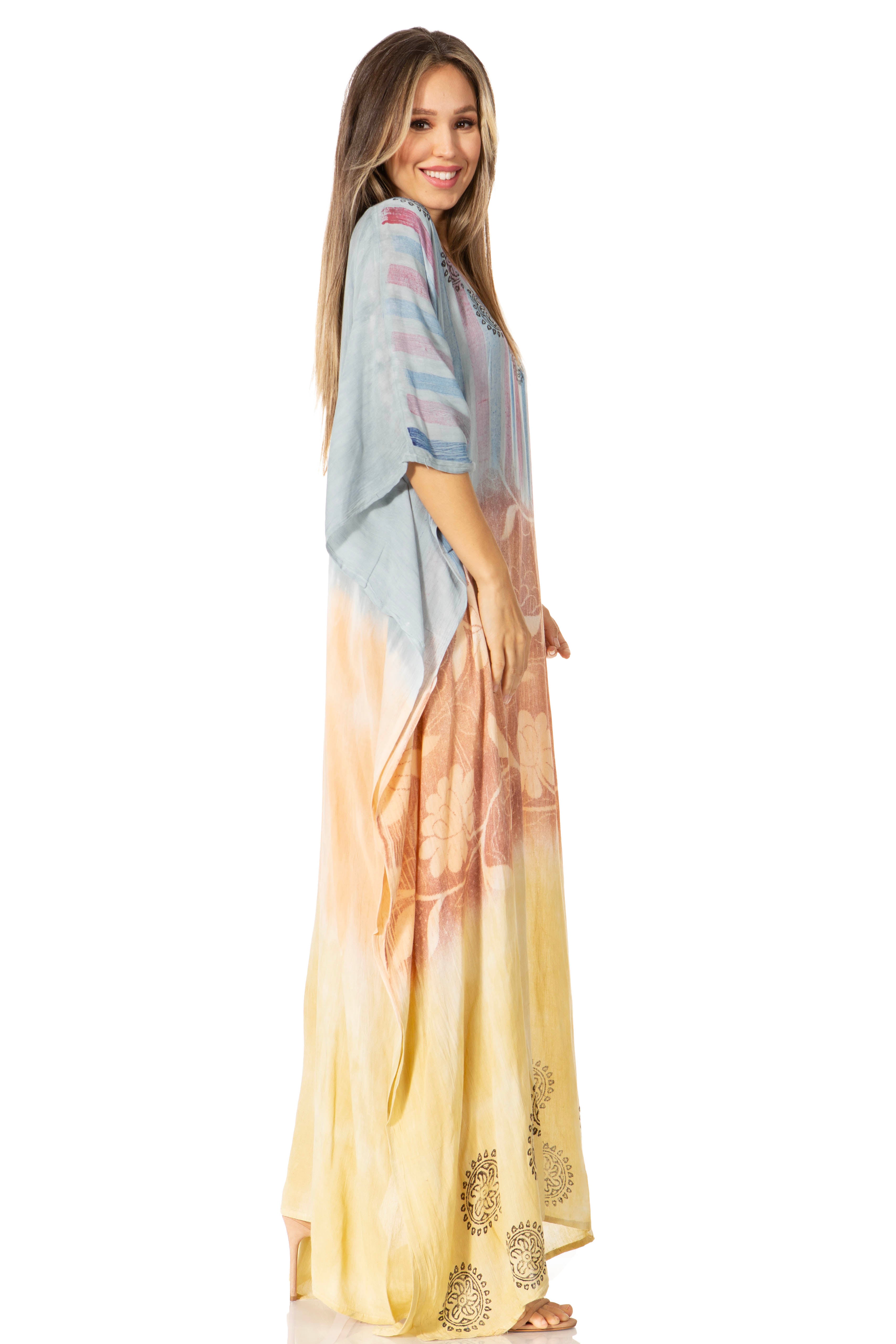 Woman wearing a colorful dress with a gradient from blue to yellow on a white background