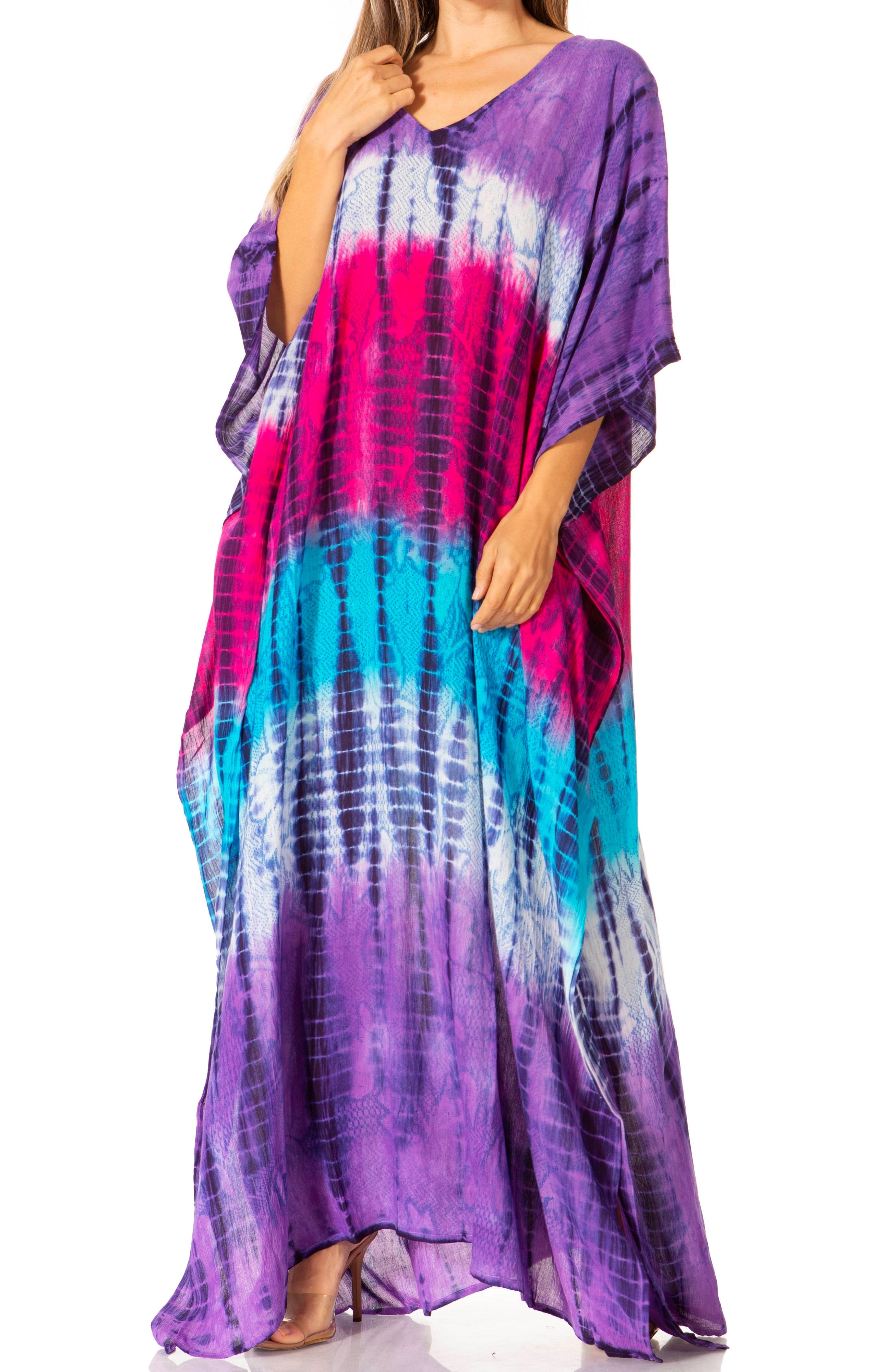 Woman wearing a tie-dye dress with purple, pink, and blue colors on a white background