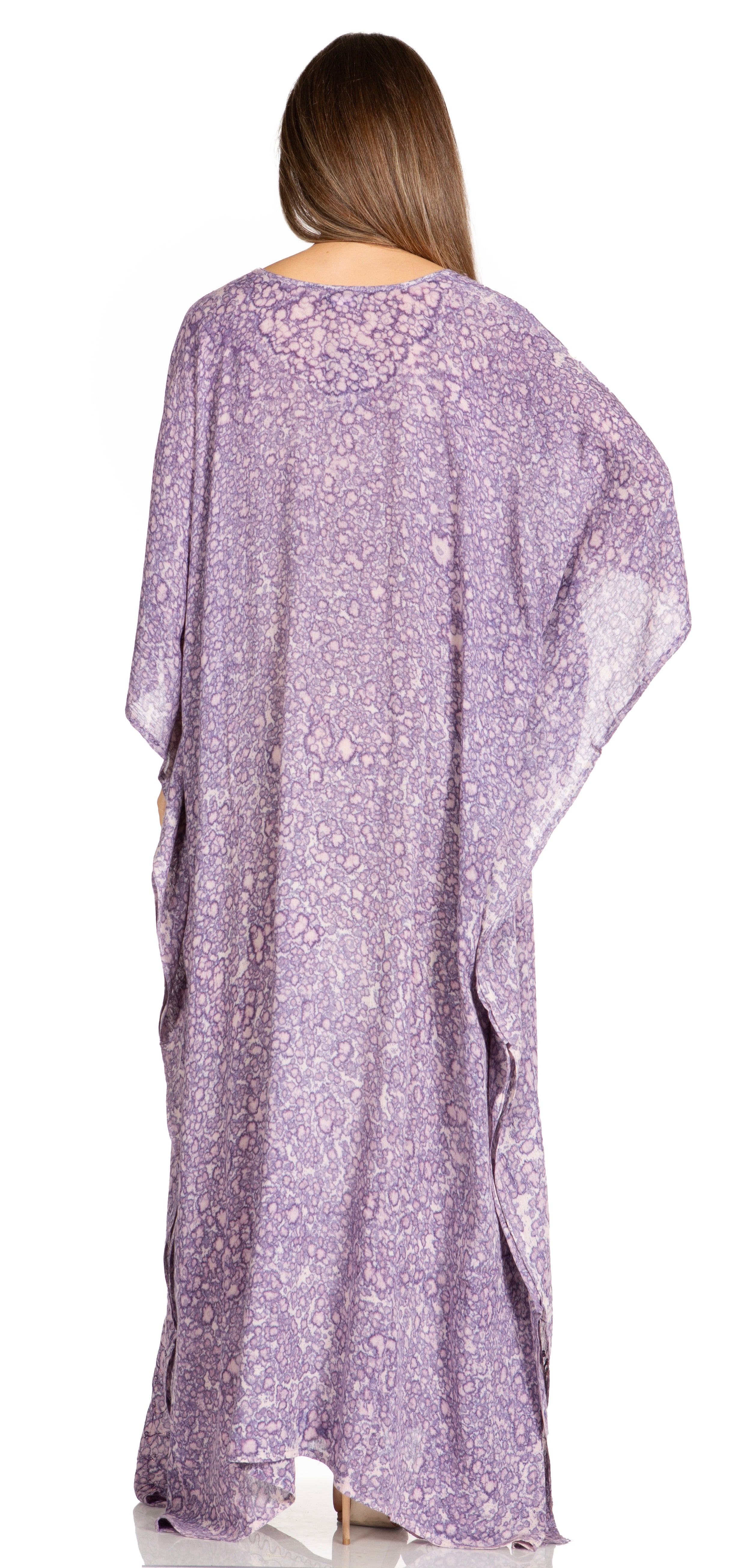 Woman wearing a purple floral dress against a white background