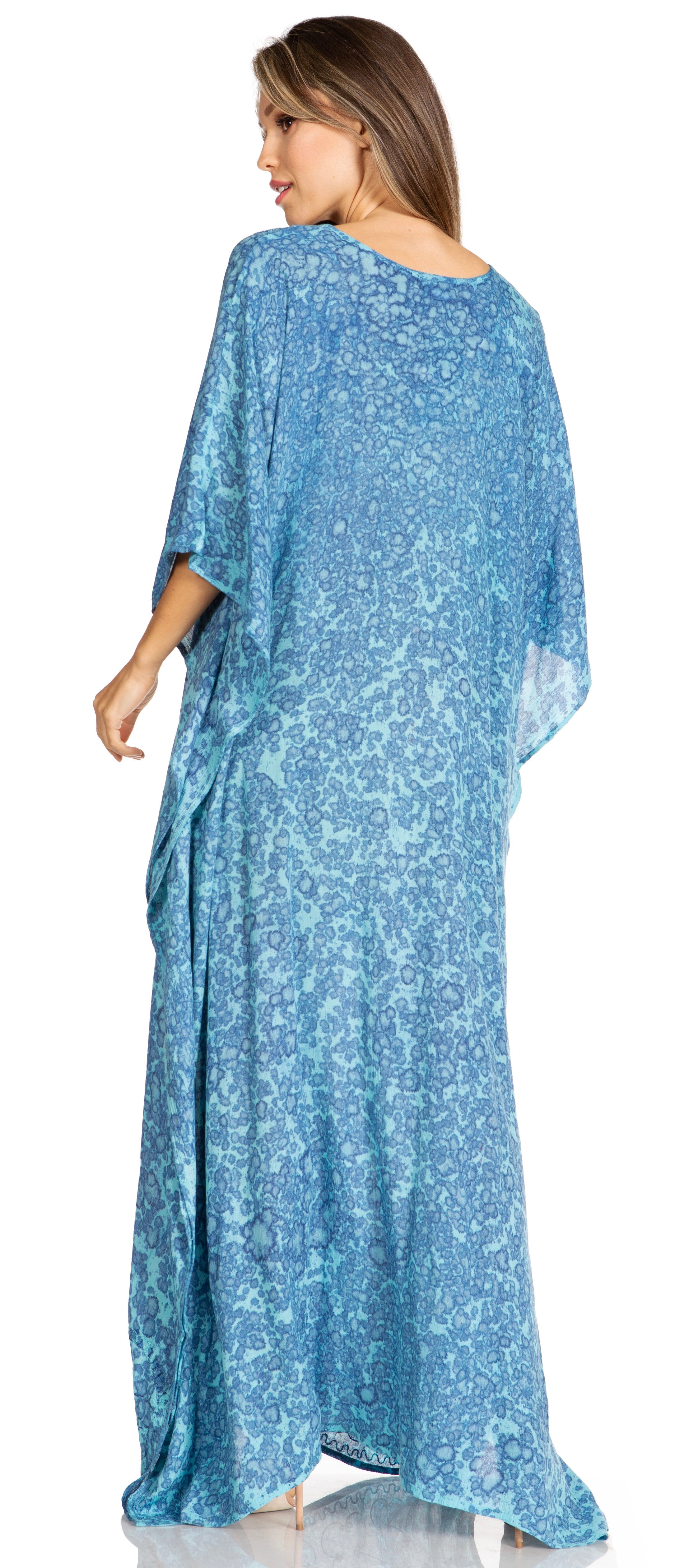 Woman wearing a blue floral dress on a white background