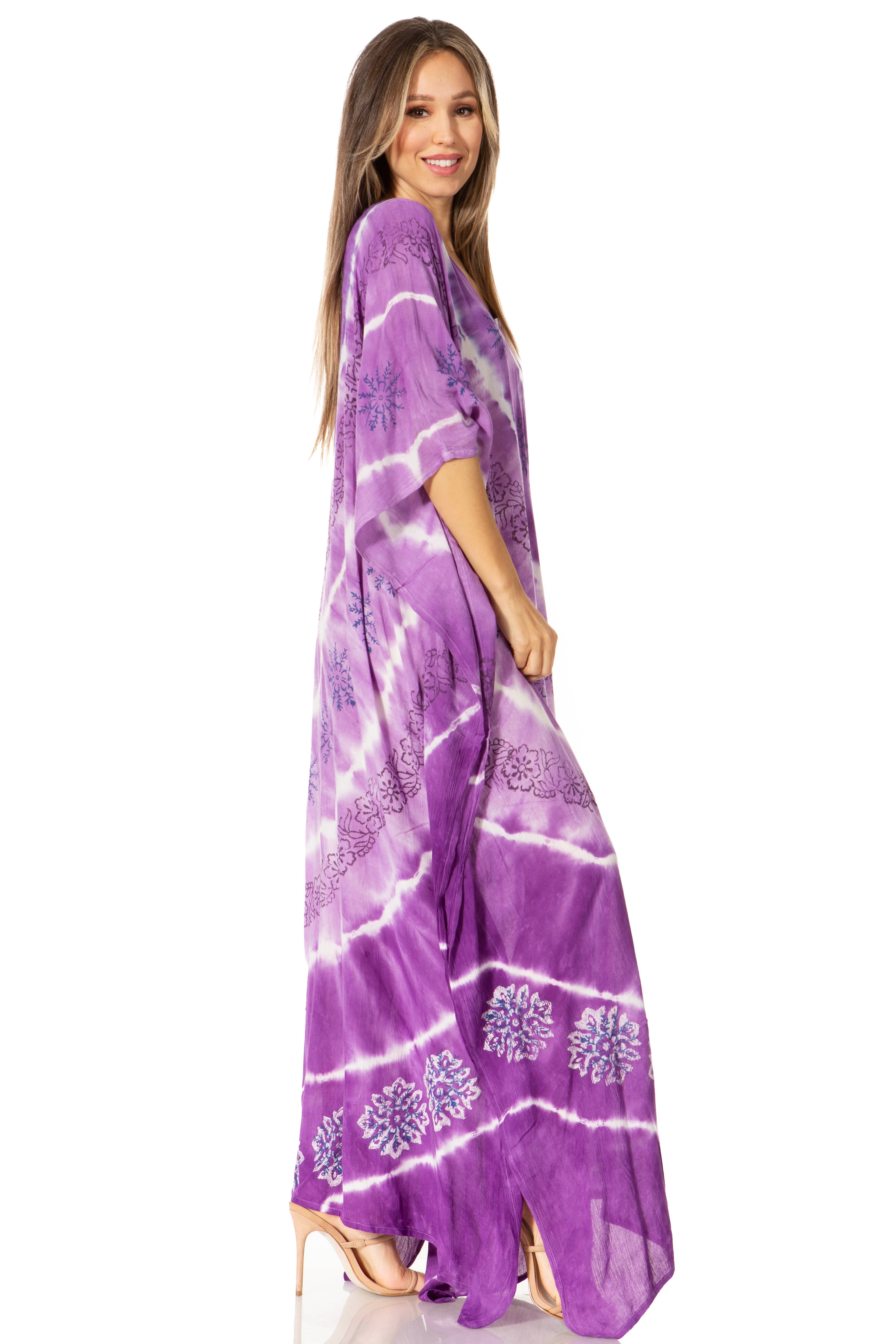 Woman wearing a purple tie-dye dress with white patterns on a white background