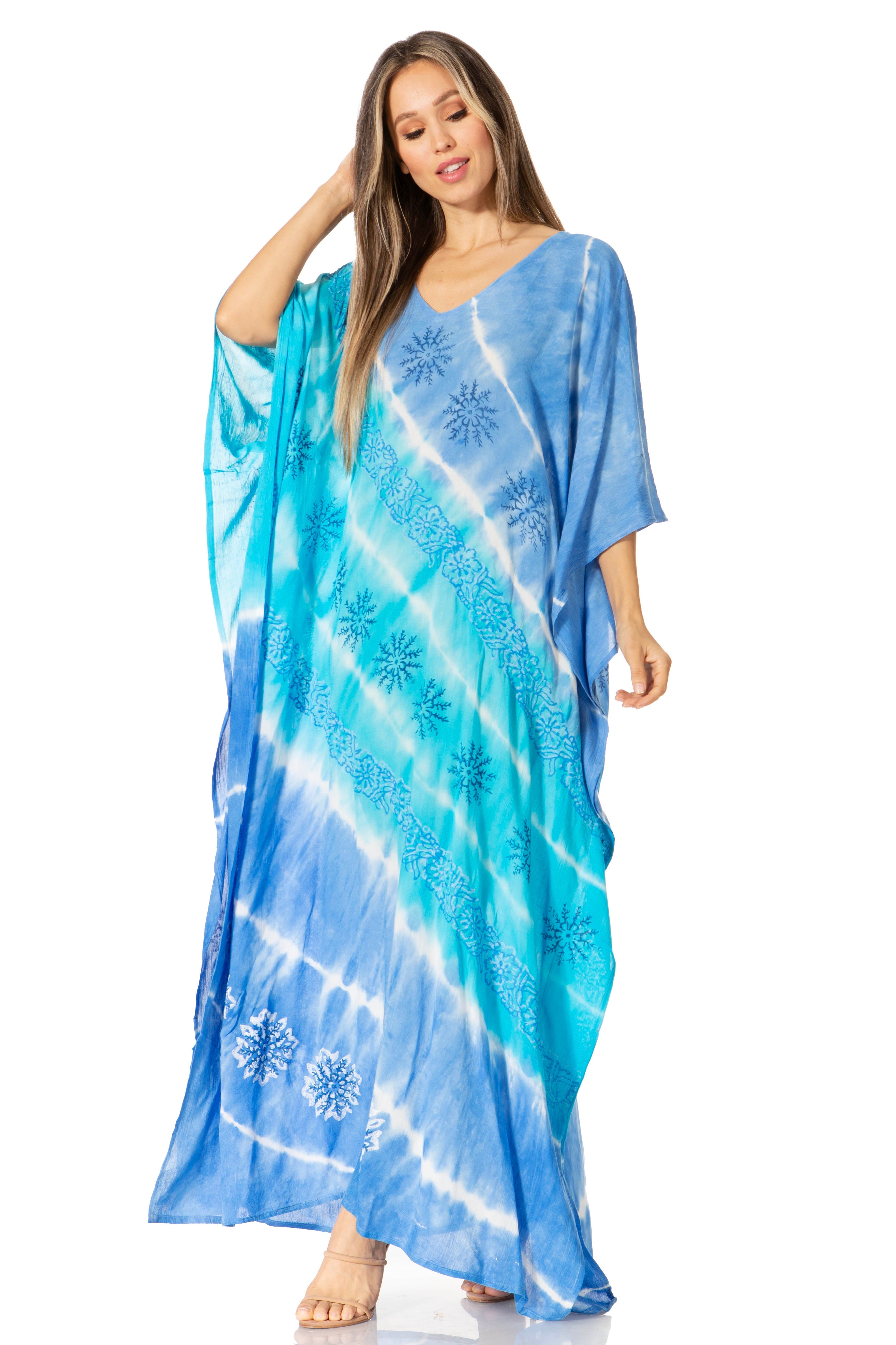 Woman wearing a blue and white tie-dye dress on a white background