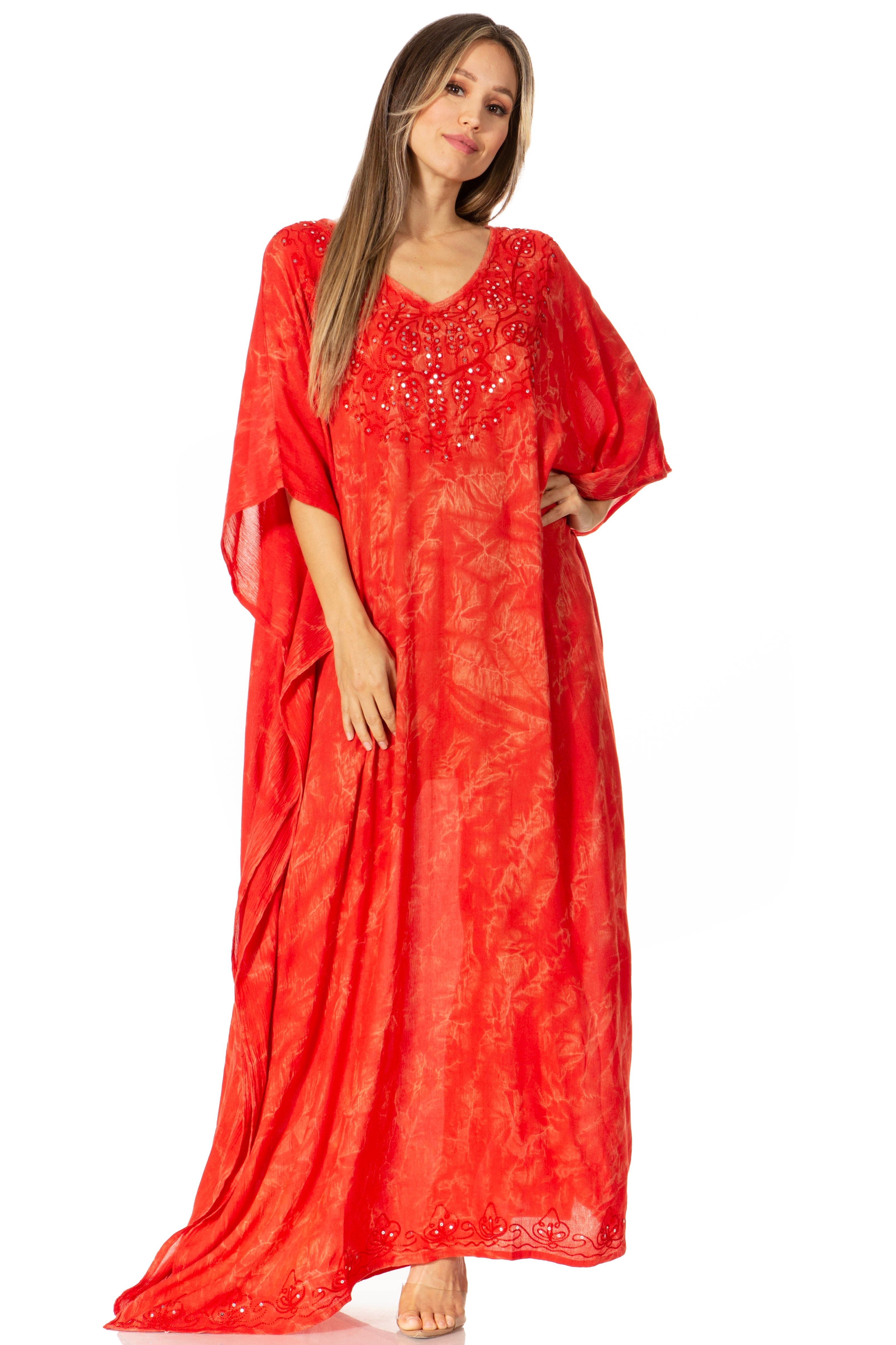Woman wearing a red dress with floral patterns on a white background