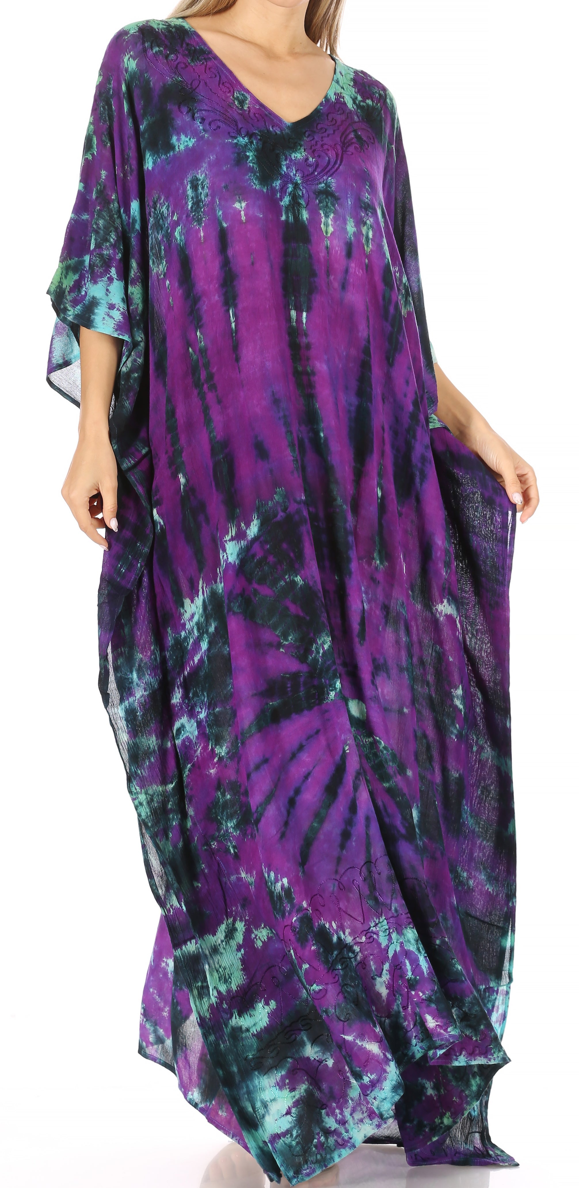 Long, patterned dress with purple and green hues on a white background