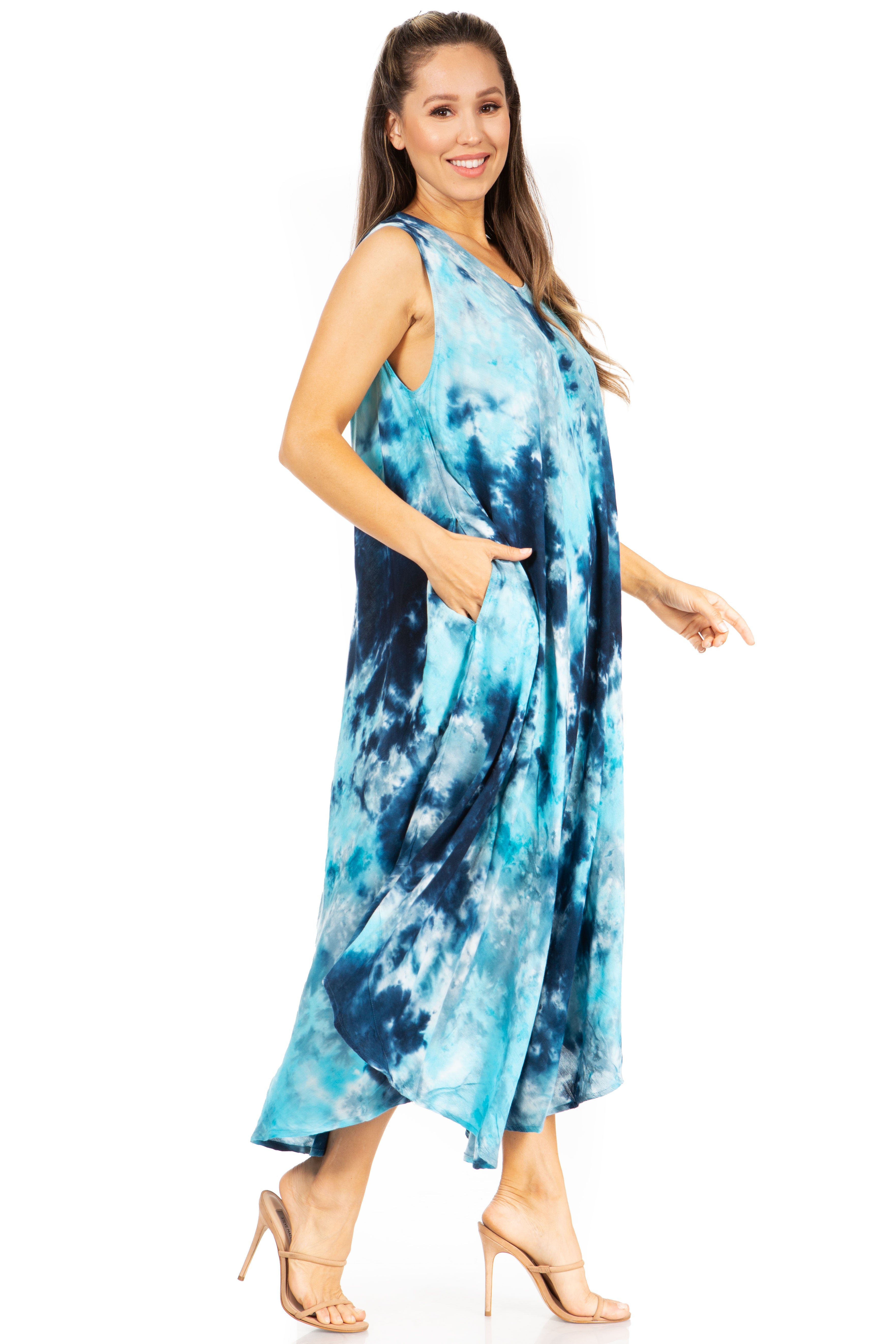 Woman wearing a blue tie-dye dress on a white background