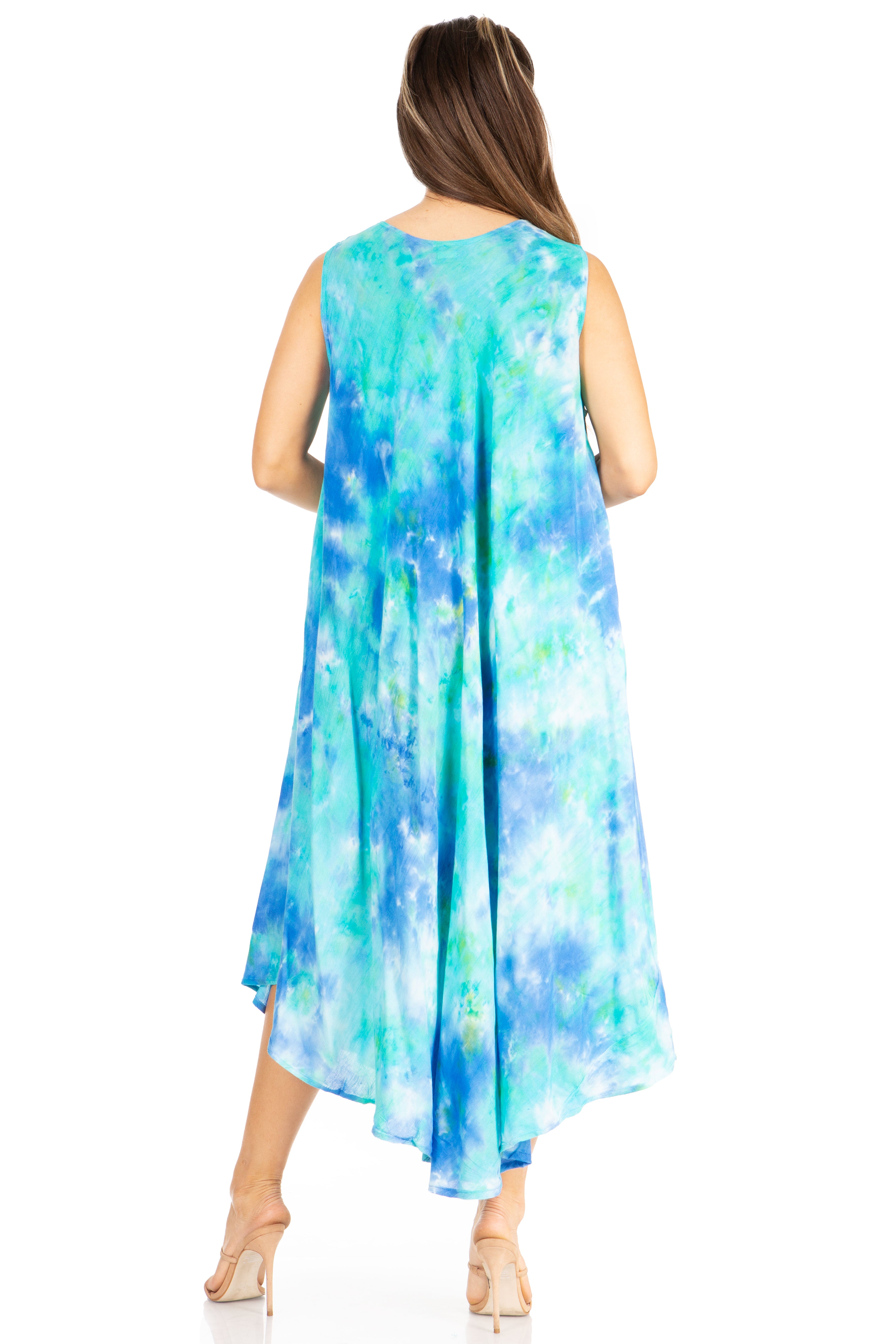 Woman wearing a sleeveless, tie-dye dress with a white background