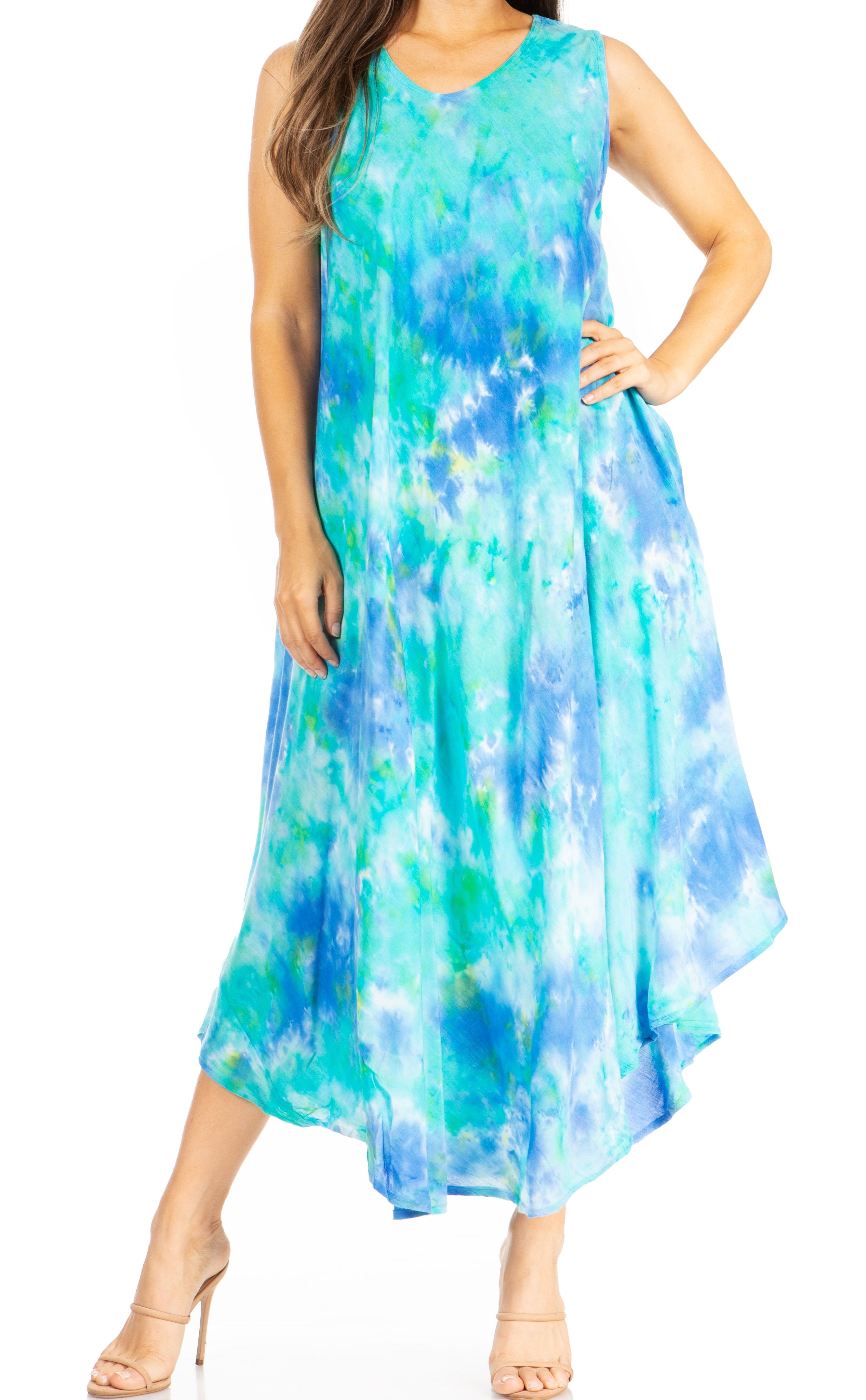 Woman wearing a sleeveless, floral-patterned dress with a white background