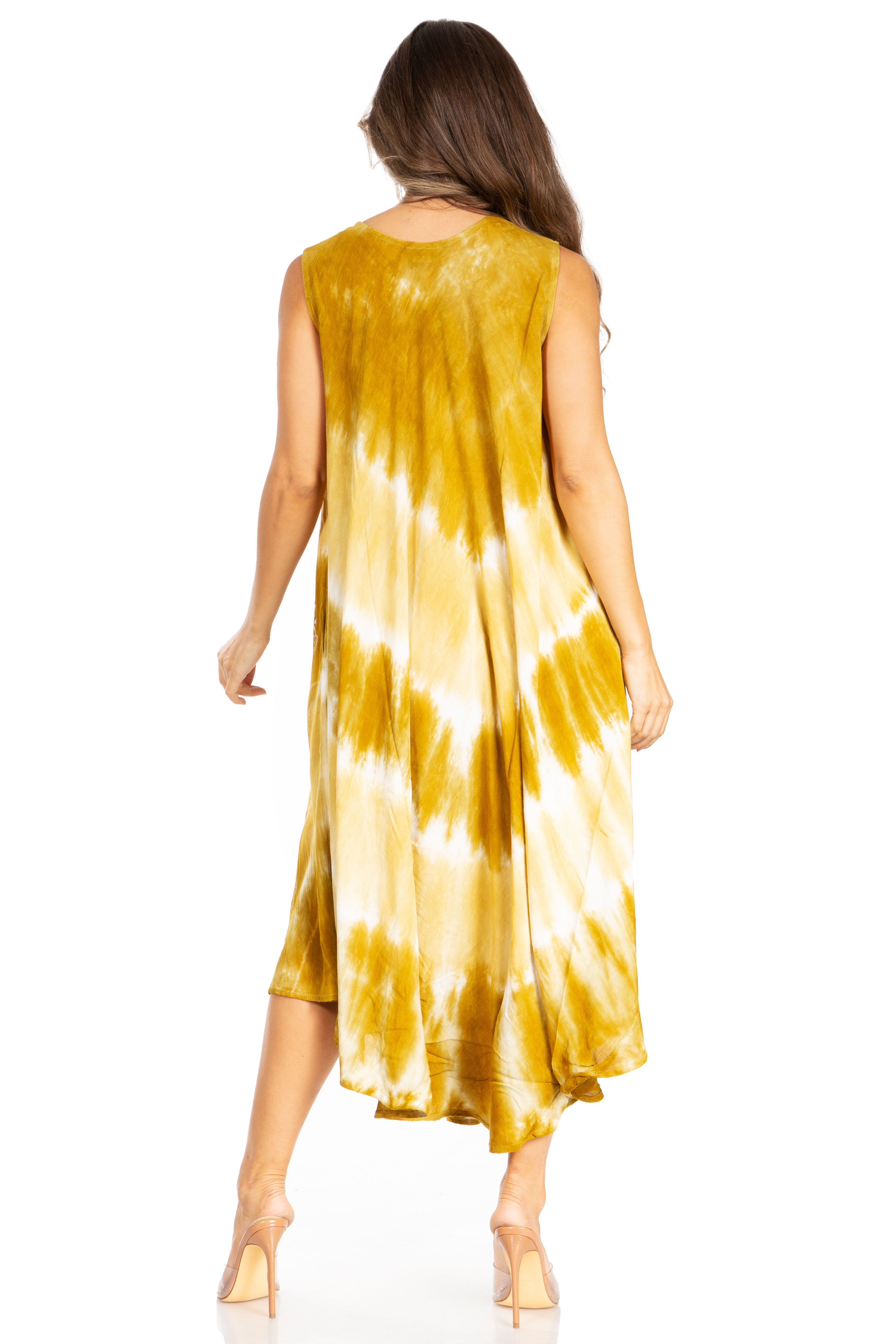 Woman wearing a yellow tie-dye dress on a white background
