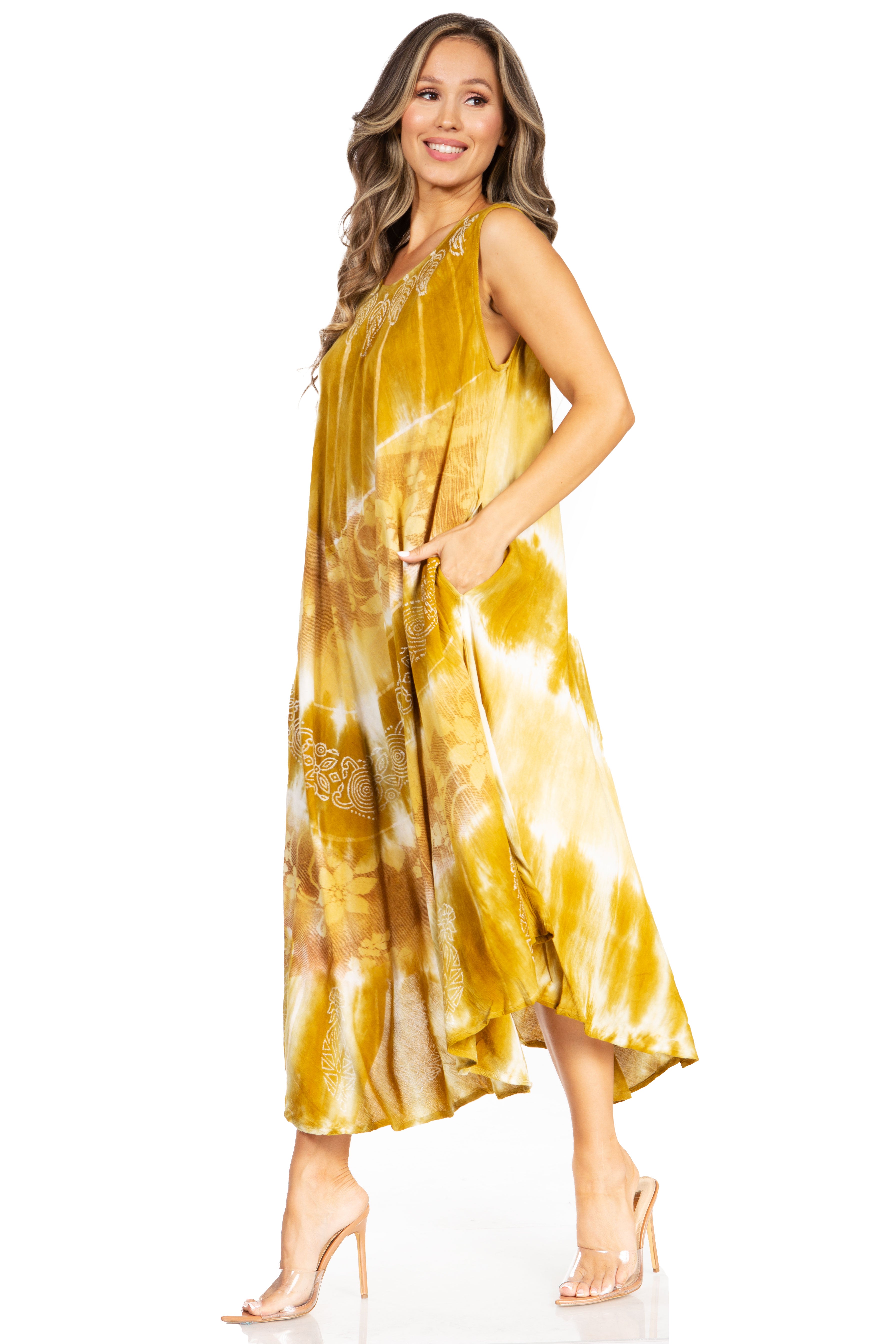 Woman wearing a yellow tie-dye dress on a white background