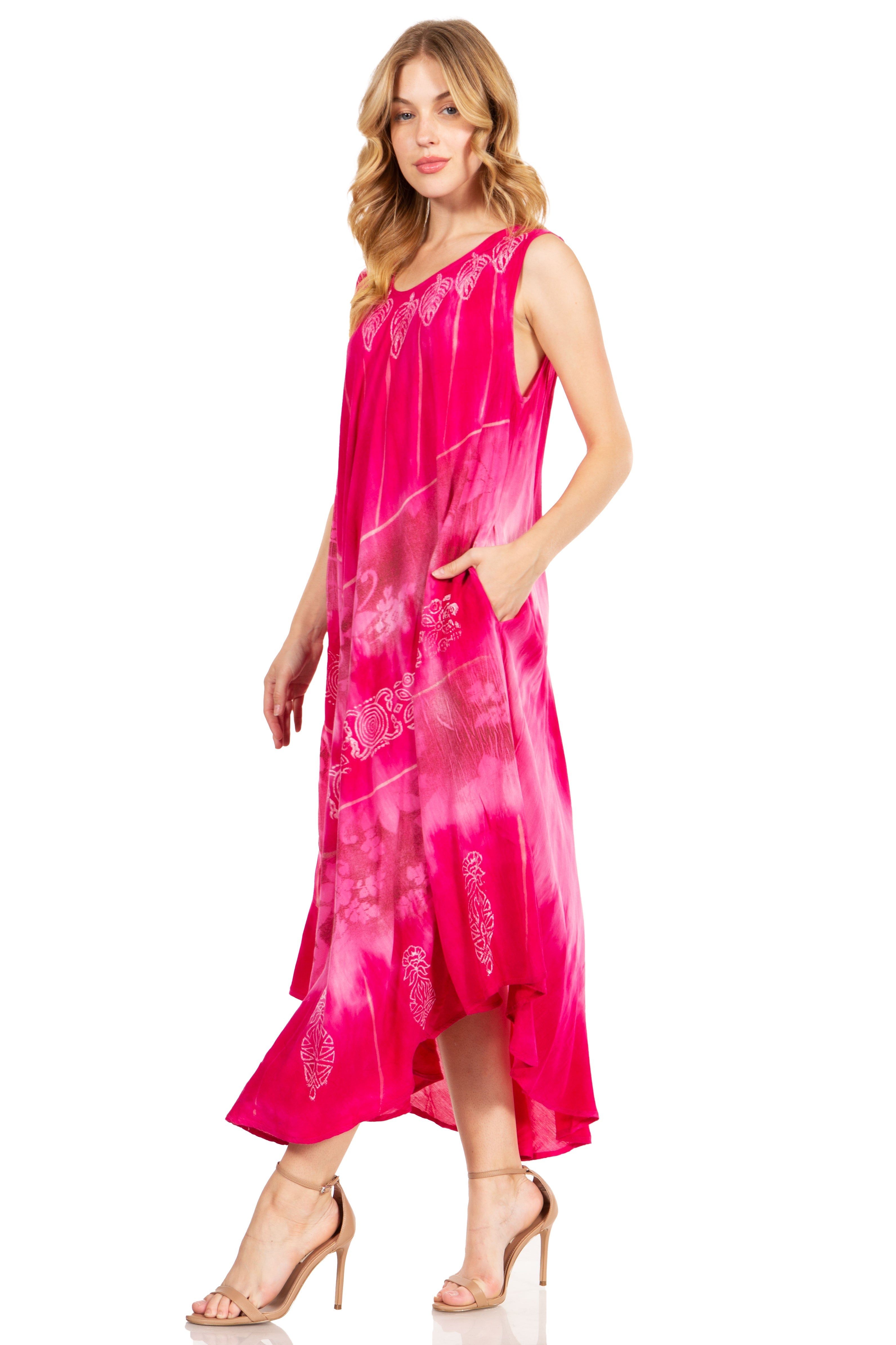 Woman wearing a pink dress with floral patterns on a white background