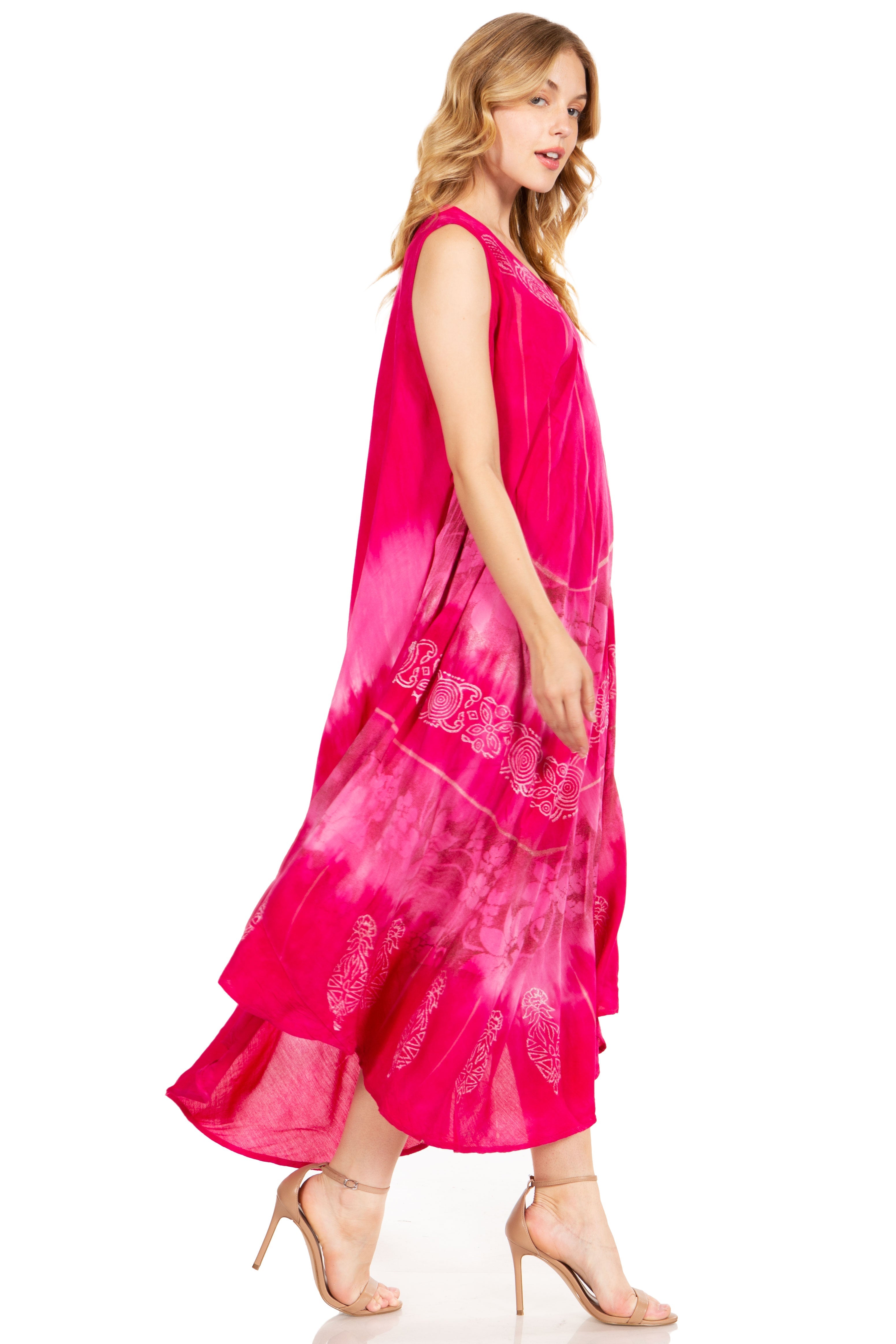 Woman wearing a pink dress with embroidery on a white background