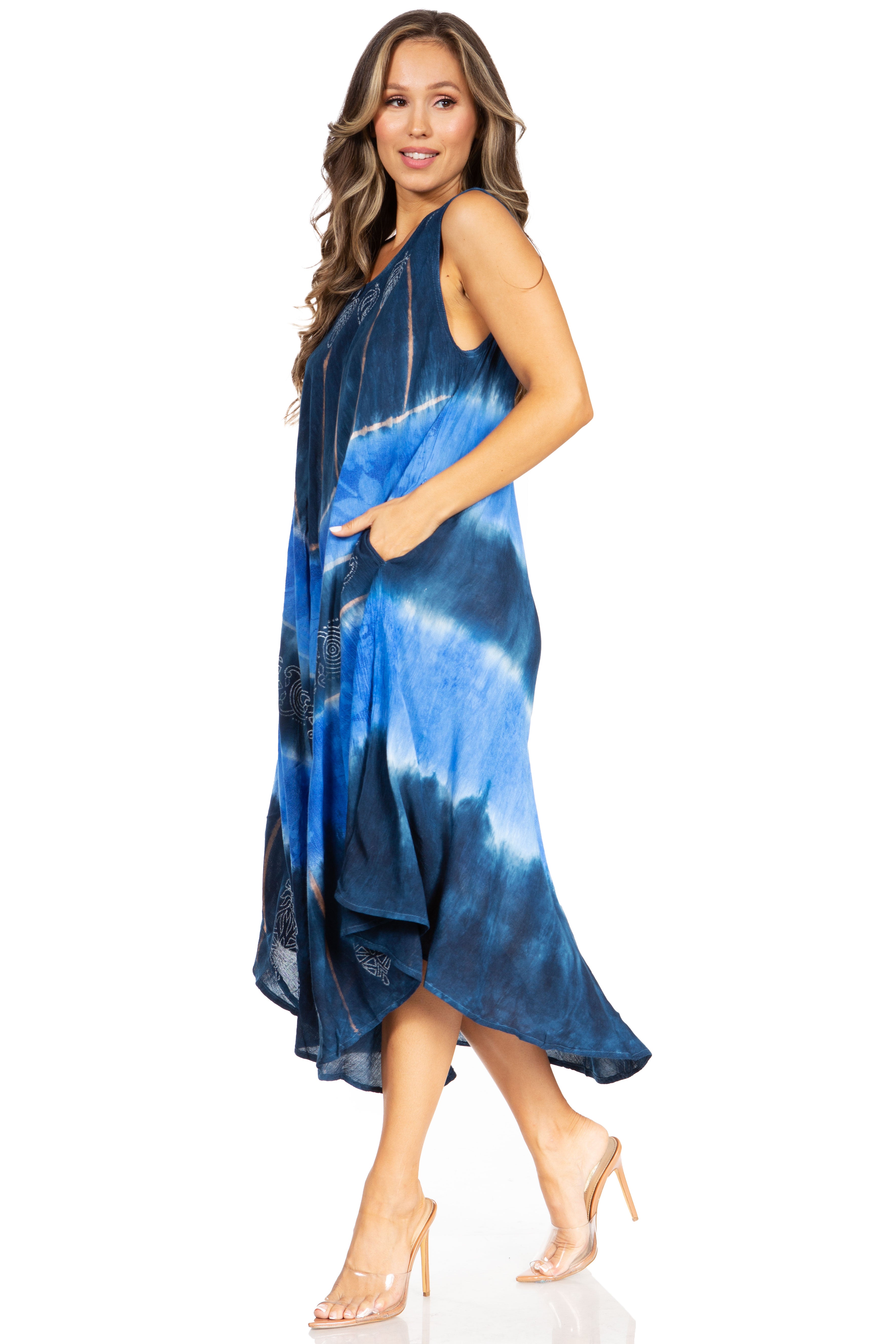 Woman wearing a blue tie-dye dress on a white background
