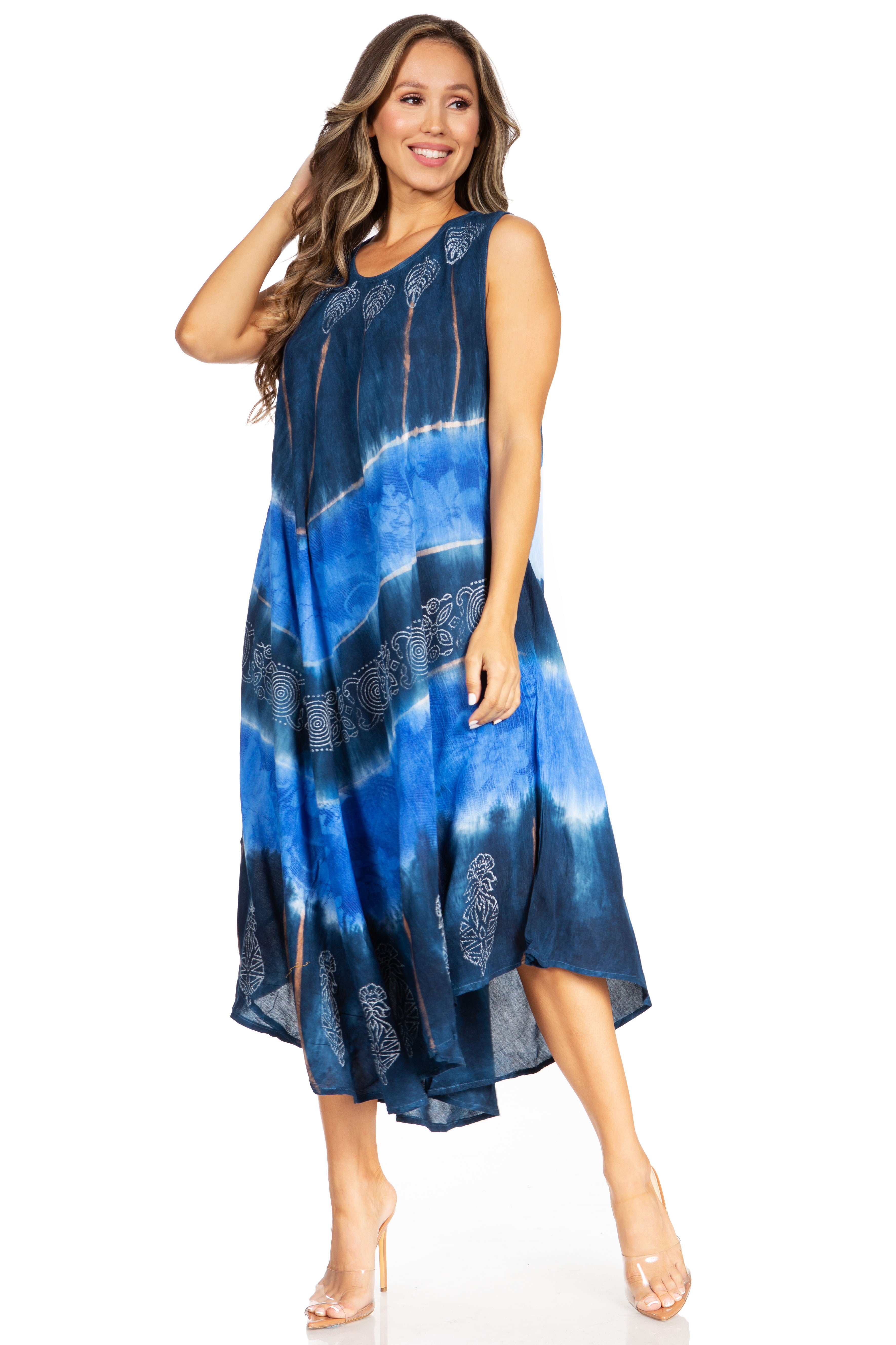 Woman wearing a blue tie-dye dress on a white background