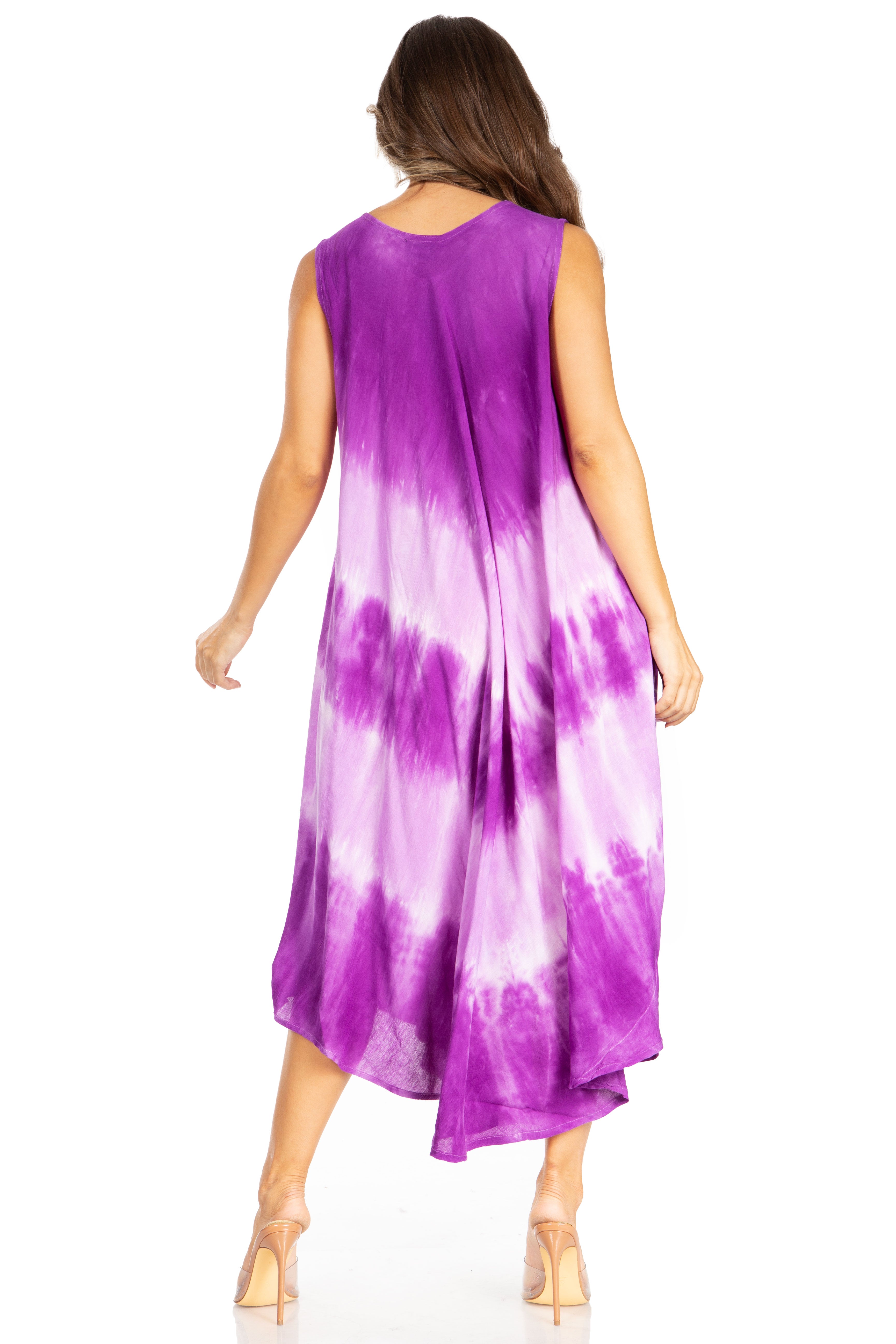 Woman wearing a purple and white tie-dye dress on a white background