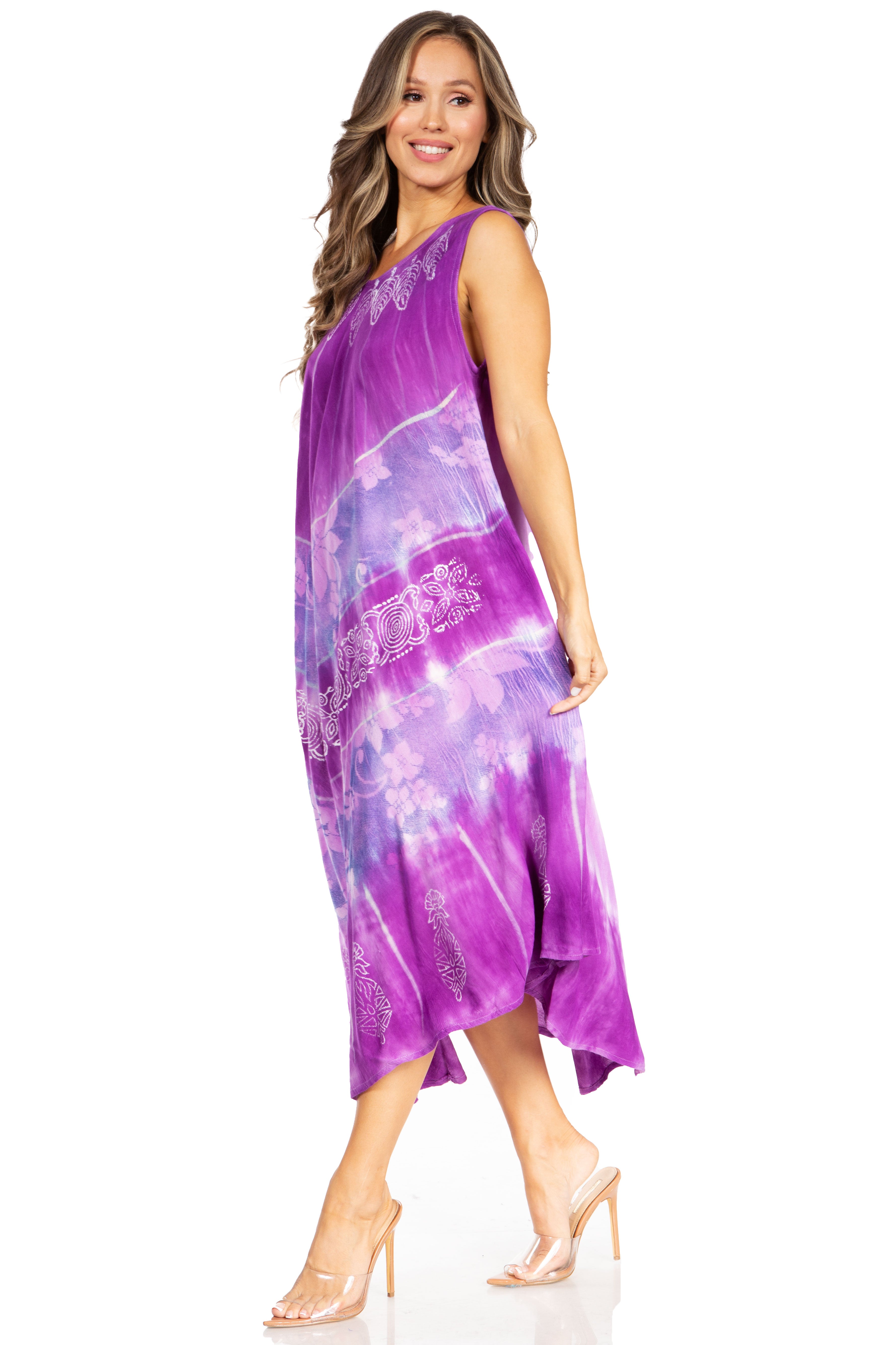 Woman wearing a purple tie-dye dress on a white background