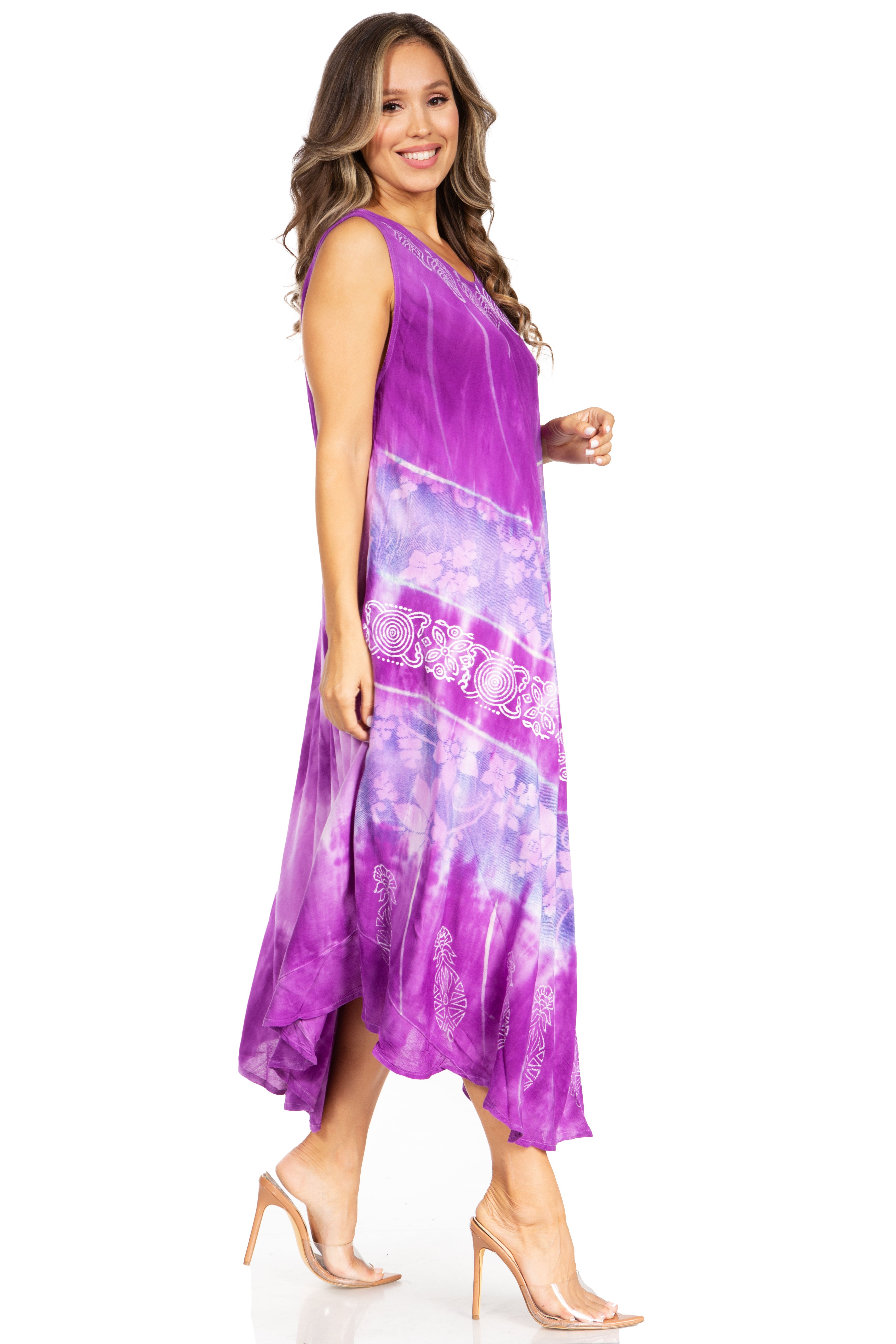 Woman wearing a purple dress with a floral pattern on a white background