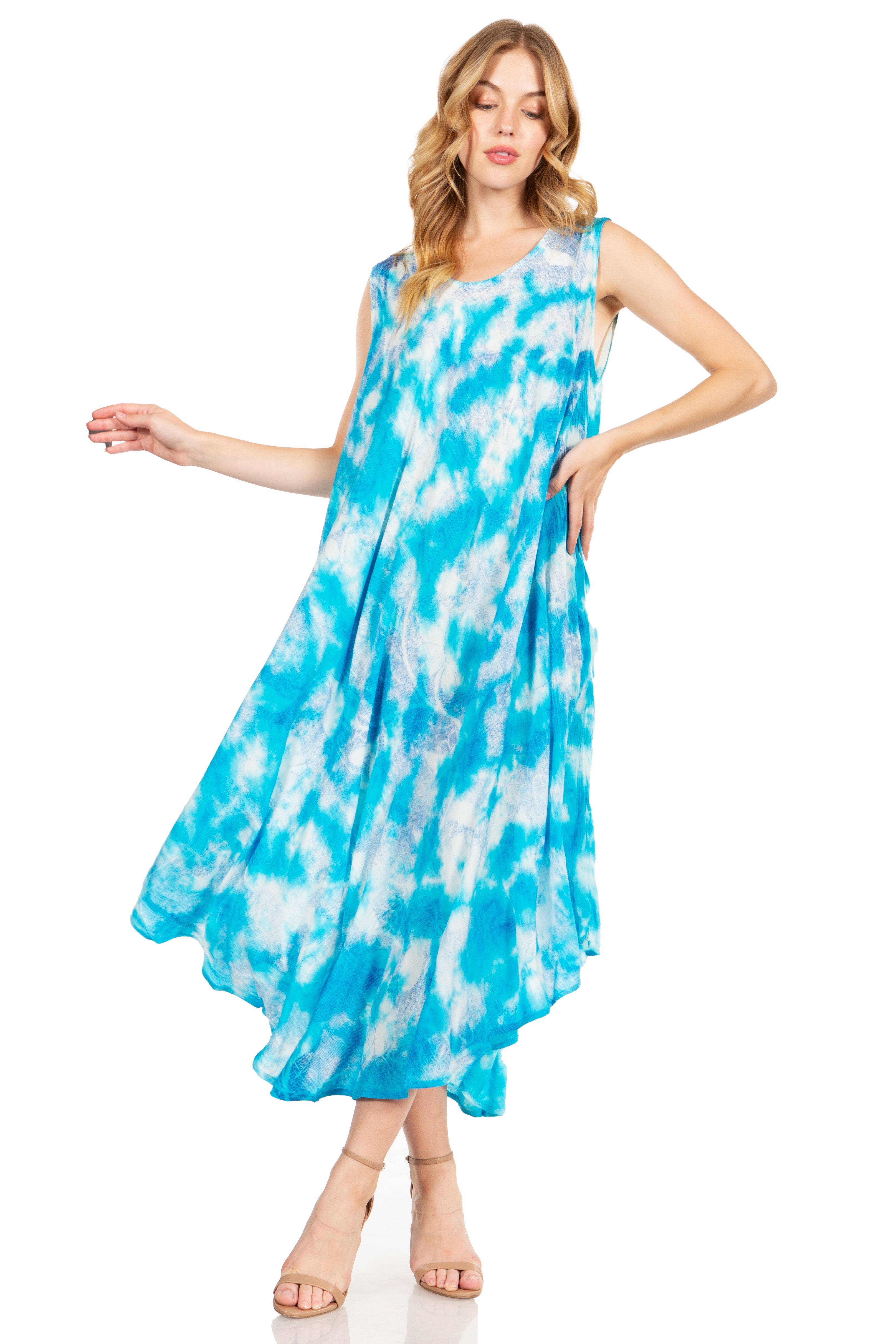 Woman wearing a blue tie-dye dress on a white background