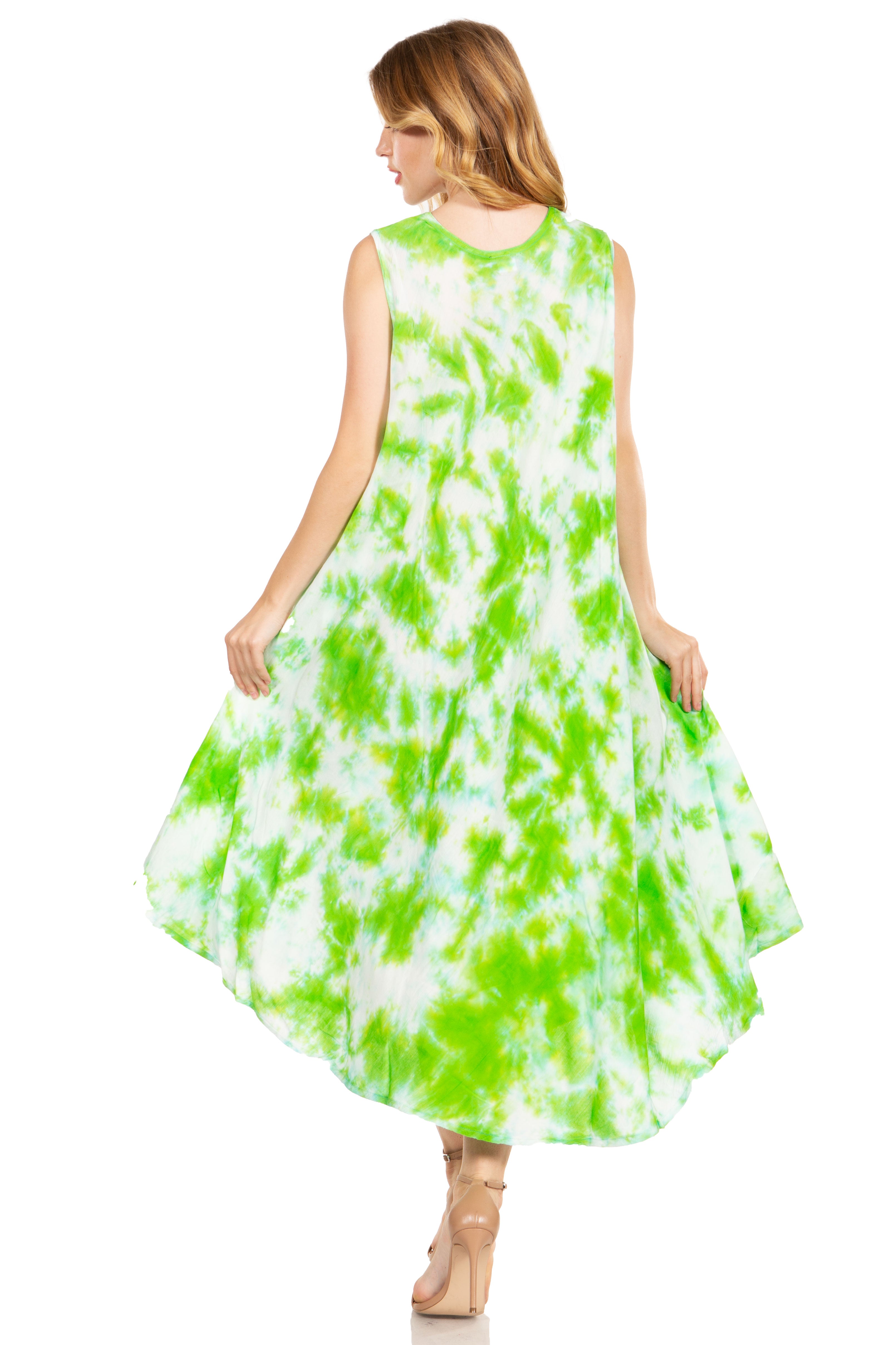 Woman wearing a sleeveless green and white dress on a white background