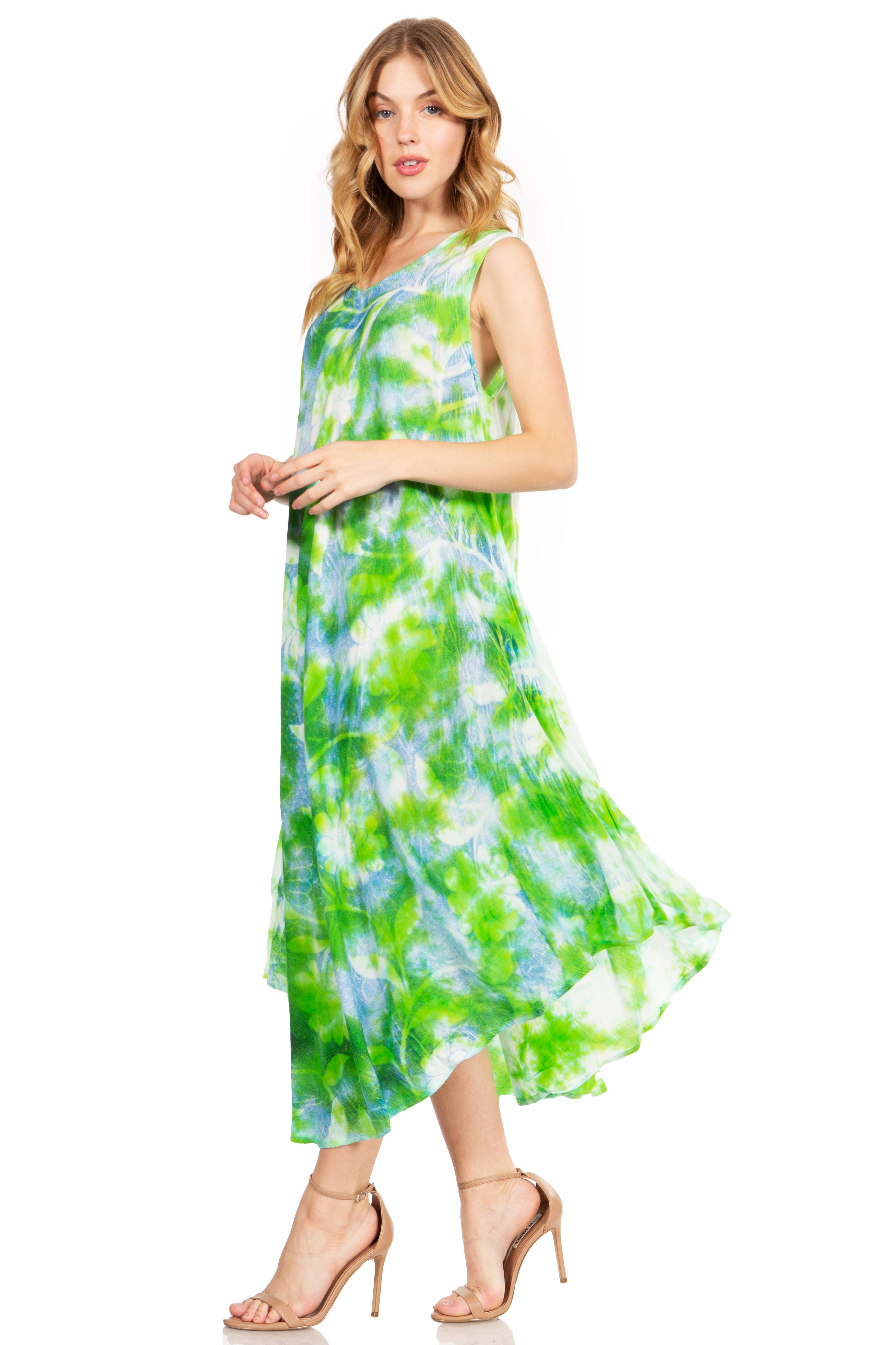 Woman wearing a green and blue tie-dye dress on a white background