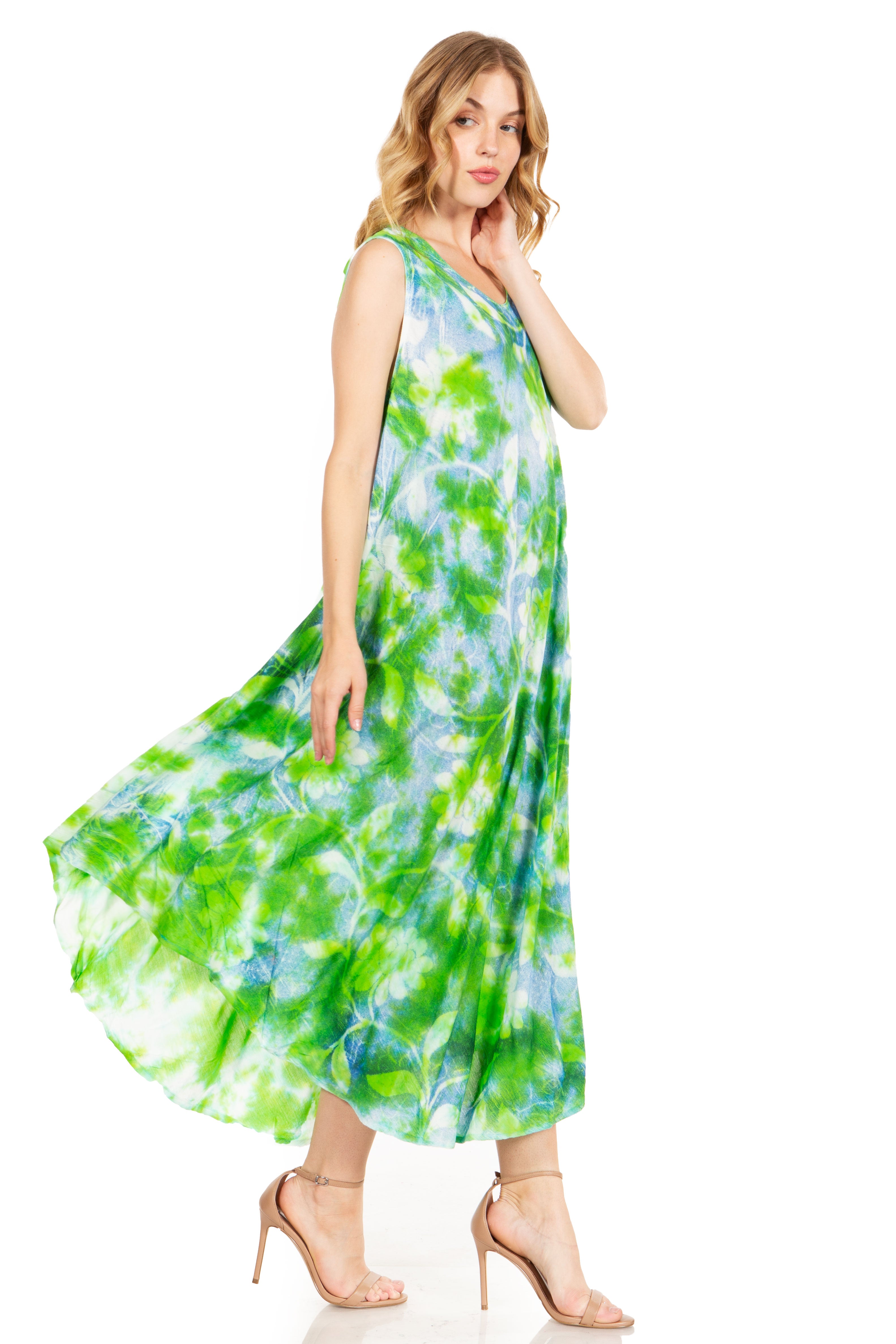 Woman wearing a green and blue tie-dye dress on a white background