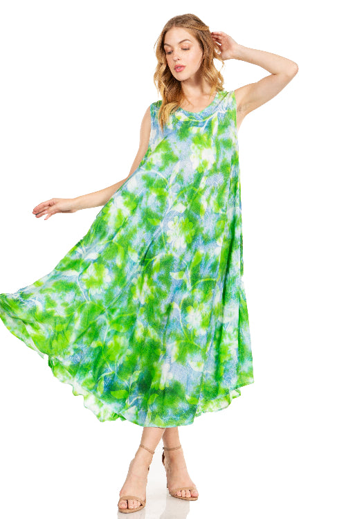 Woman wearing a green and blue tie-dye dress on a white background