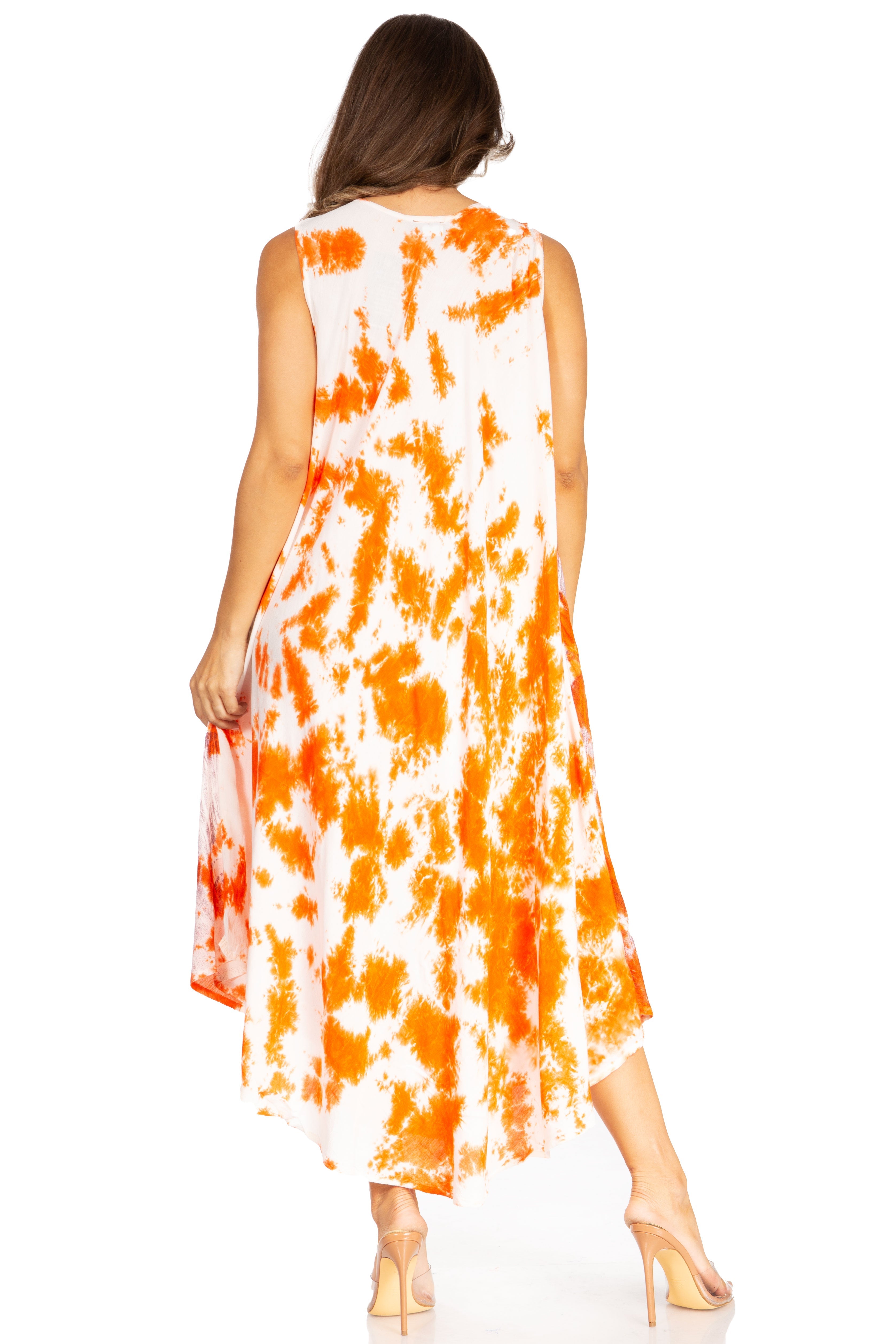 Woman wearing a sleeveless dress with orange and white tie-dye pattern on a white background