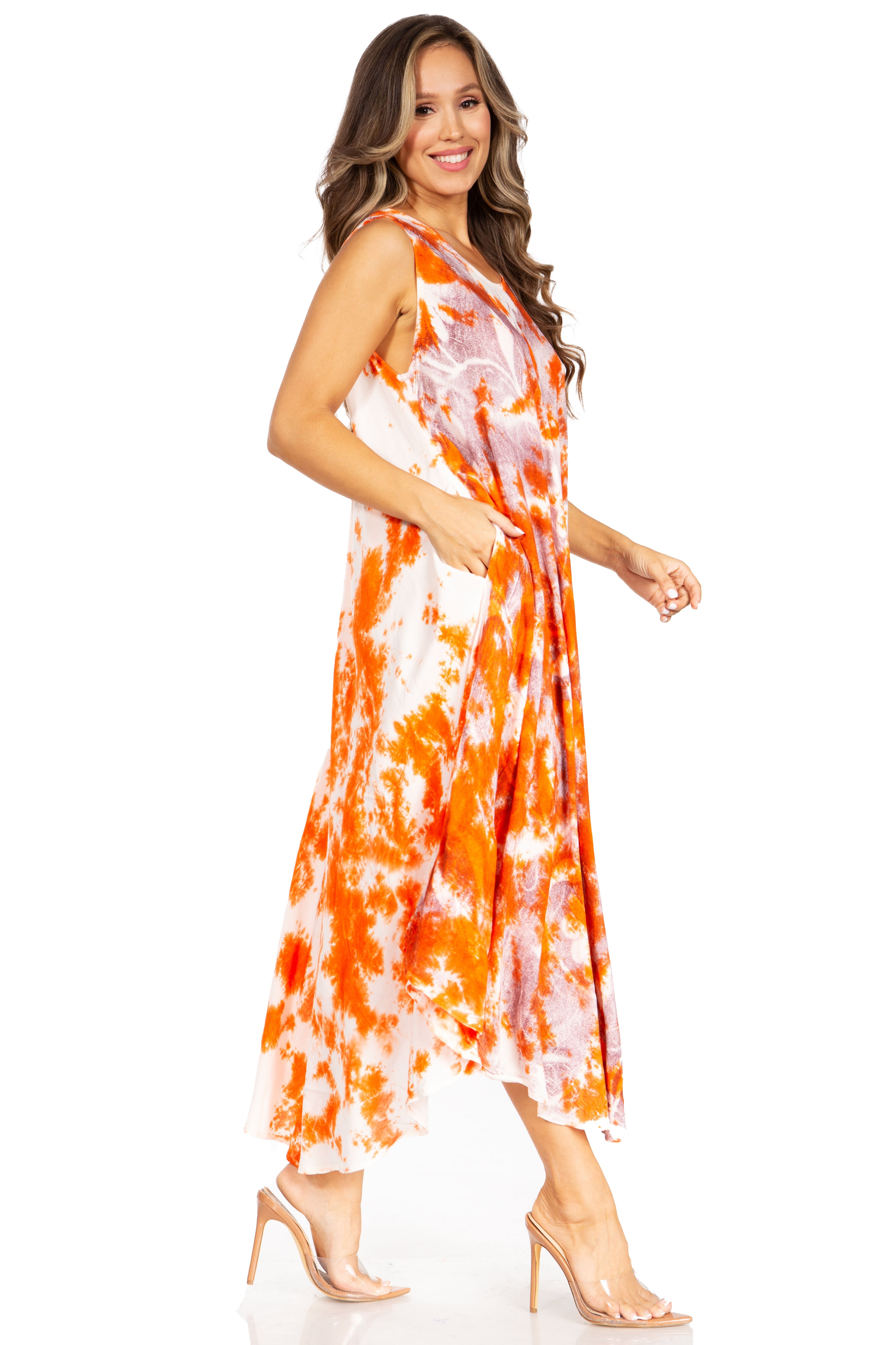 Woman wearing an orange and white tie-dye dress on a white background