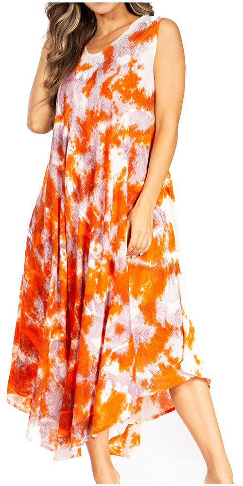 Woman wearing a sleeveless dress with orange and white tie-dye pattern on a white background