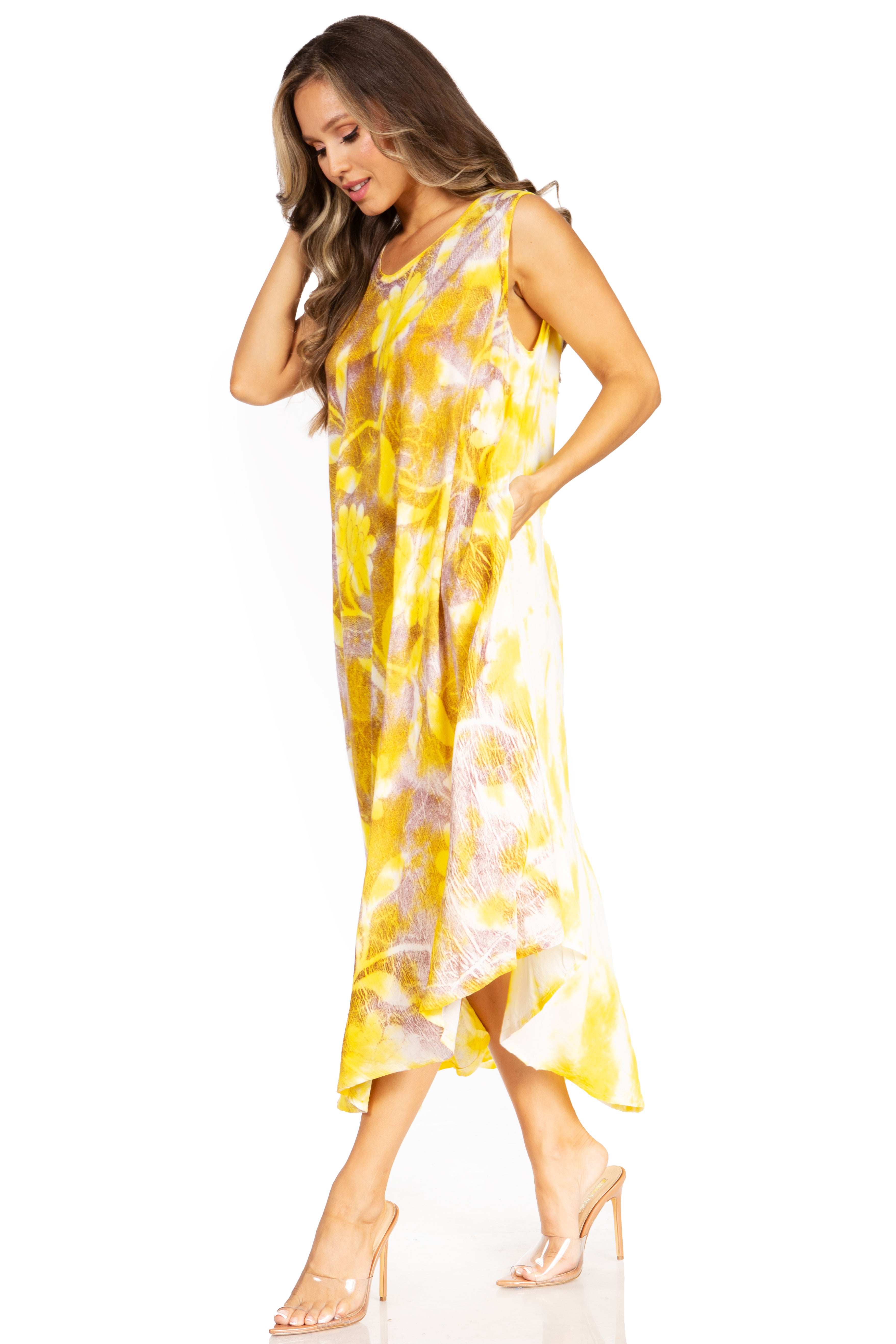 Woman wearing a yellow floral dress on a white background
