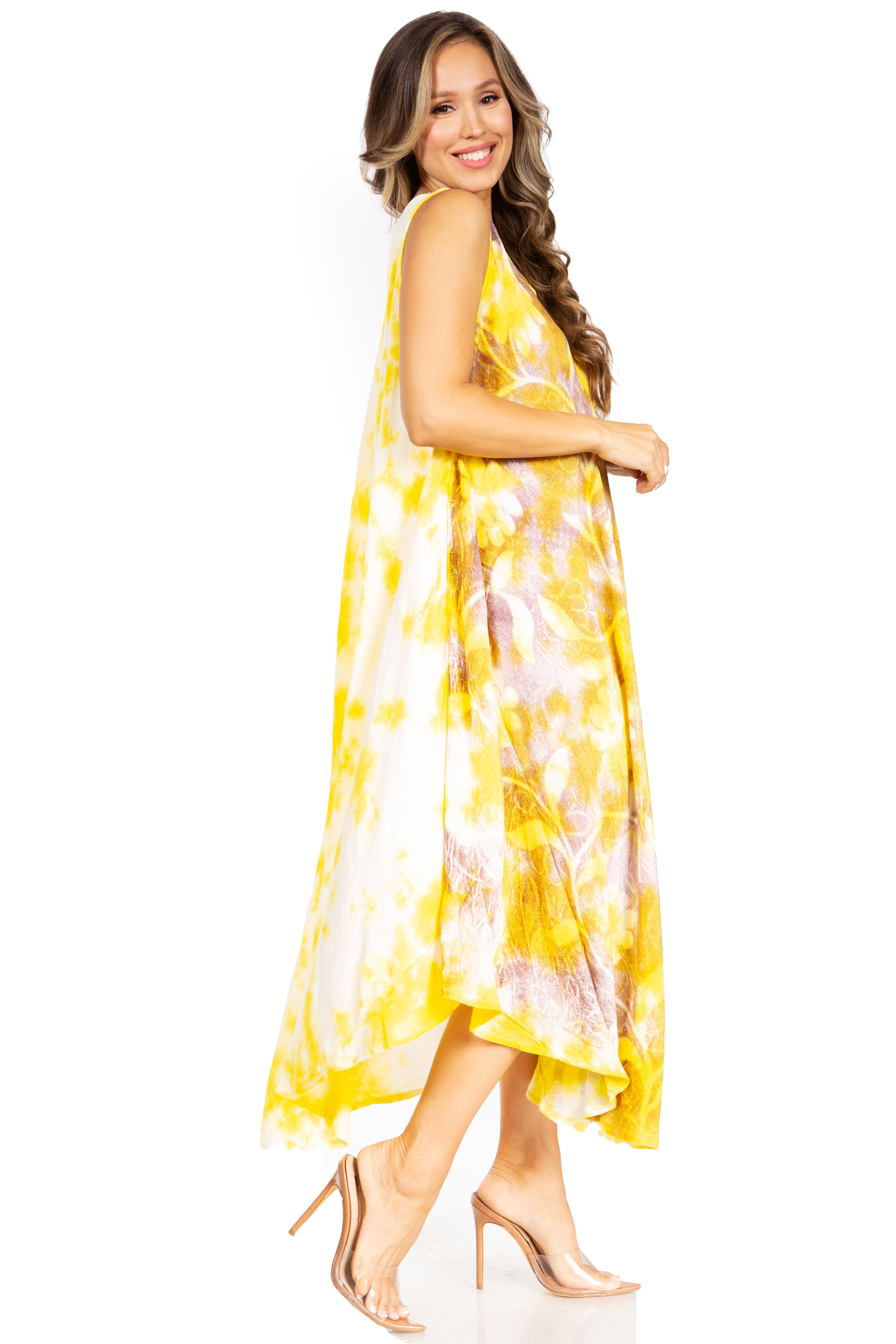 Woman wearing a yellow and white patterned dress on a white background