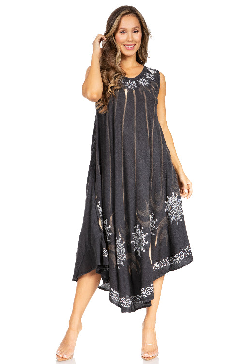 Woman wearing a black dress with white floral patterns on a white background