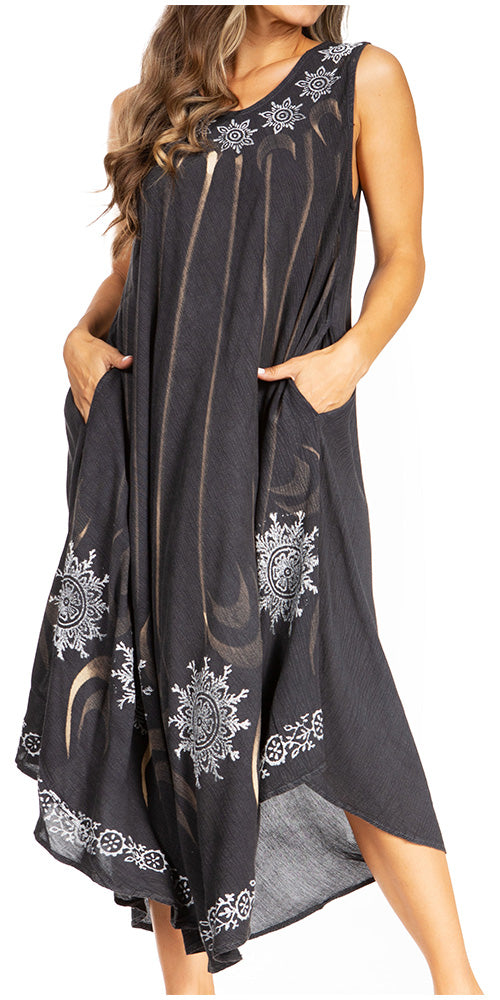 Black sleeveless dress with white patterns on a white background