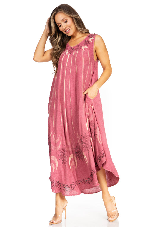Woman wearing a pink dress with floral patterns on a white background