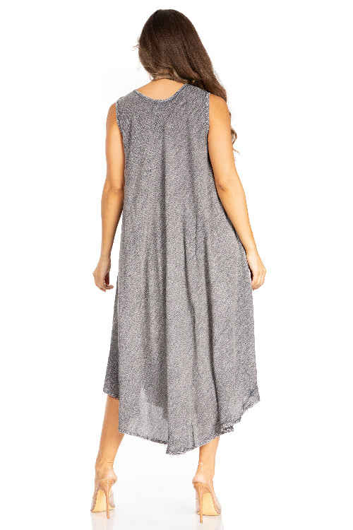 Woman wearing a gray sleeveless dress on a white background