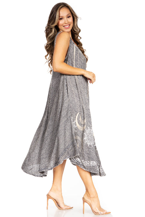 Woman wearing a gray dress with lace details on a white background