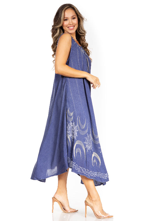 Woman wearing a blue dress with moon designs on a white background