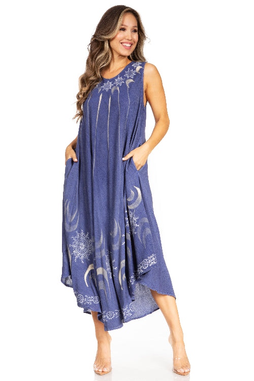 Woman wearing a blue dress with moon and star patterns on a white background