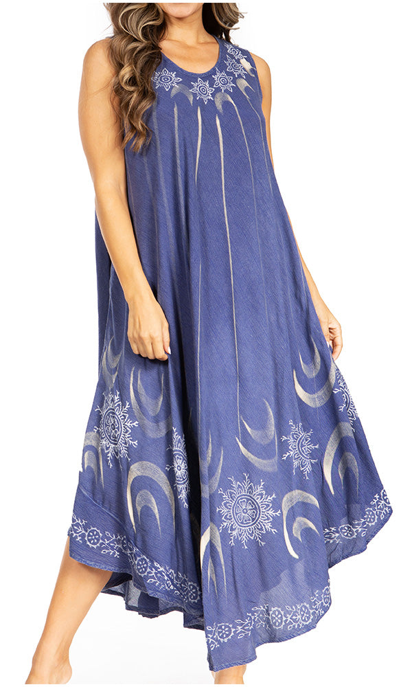 Woman wearing a blue dress with white patterns on a white background