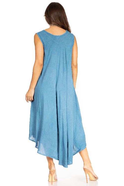 Woman wearing a blue sleeveless dress on a white background
