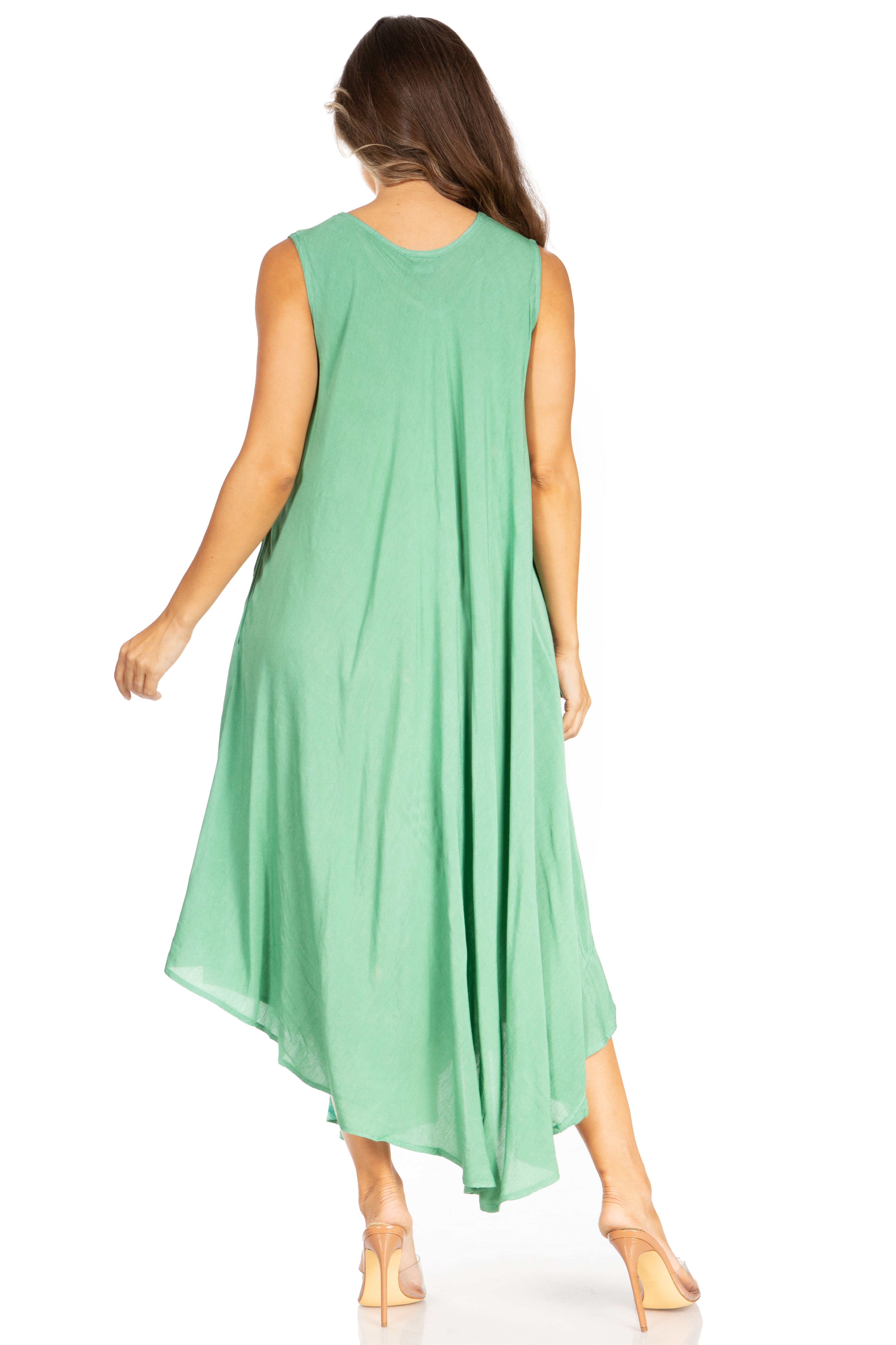 Woman wearing a green sleeveless dress on a white background