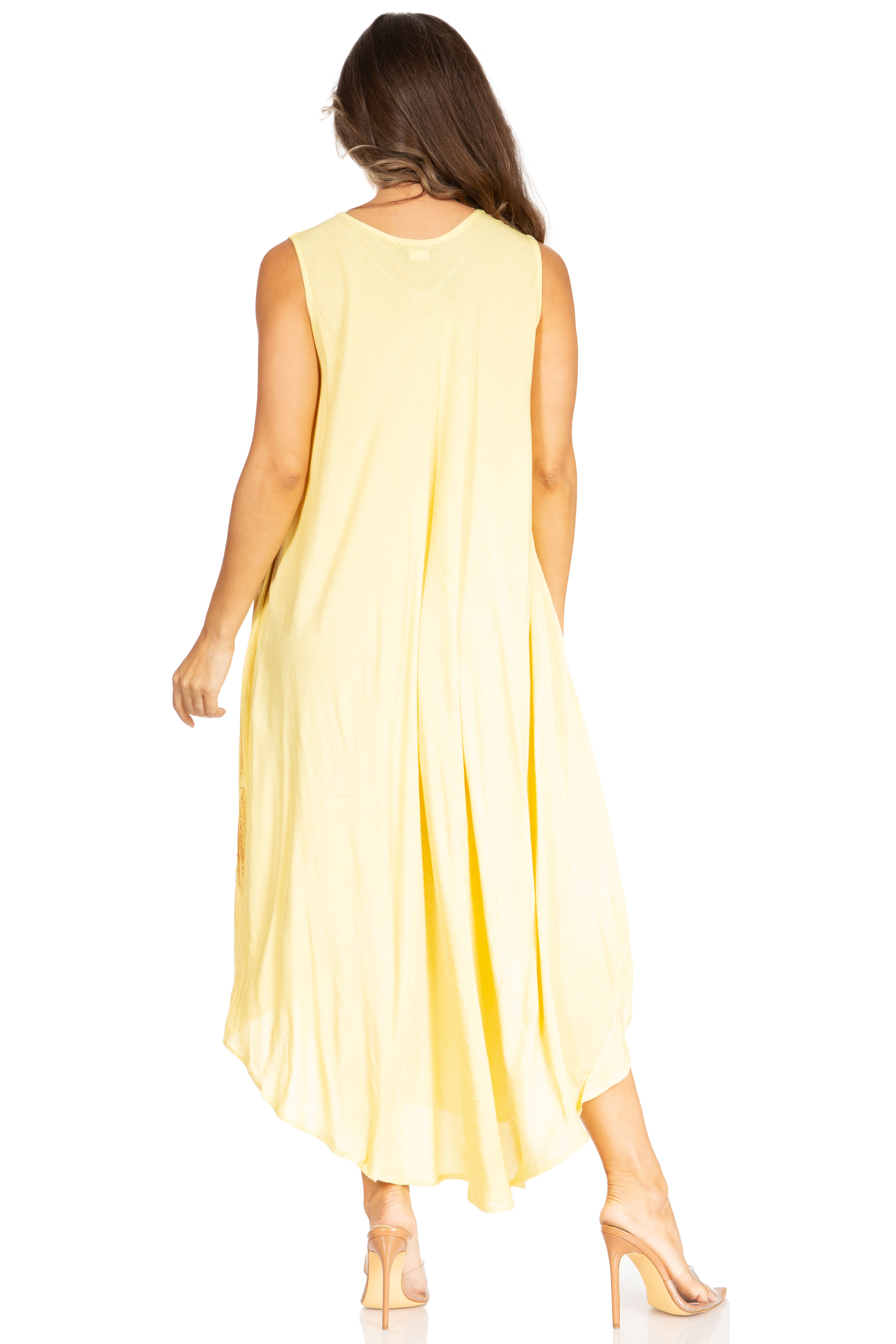 Woman wearing a yellow sleeveless dress on a white background
