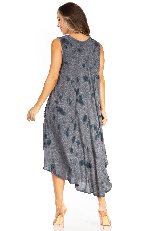 Woman wearing a sleeveless, tie-dye dress on a white background
