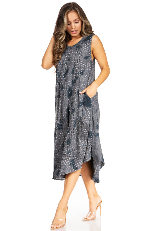 Woman wearing a sleeveless, patterned dress on a white background