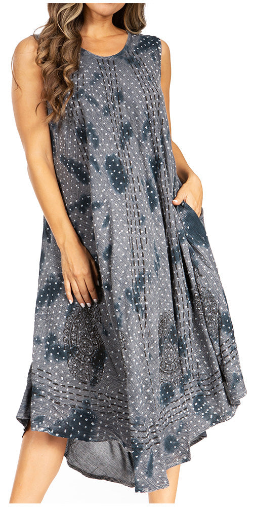 Woman wearing a sleeveless, patterned dress on a white background