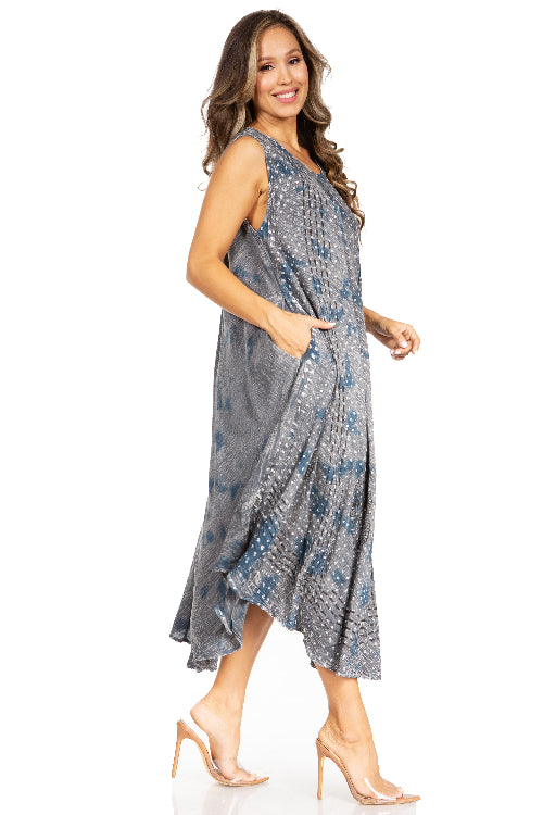 Woman wearing a sleeveless, patterned dress on a white background