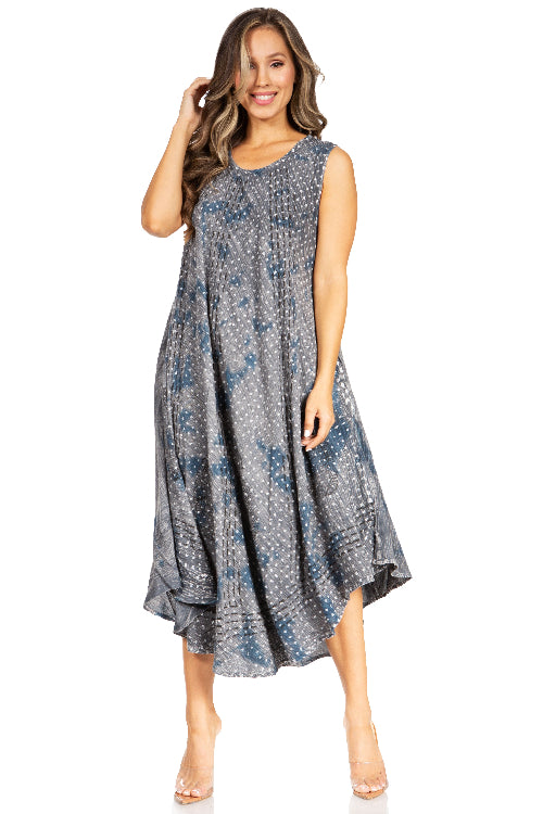 Woman wearing a sleeveless, patterned dress on a white background