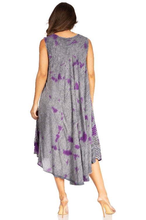 Woman wearing a sleeveless dress with purple floral pattern on a white background