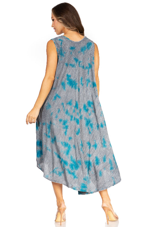 Woman wearing a sleeveless dress with blue abstract pattern on a white background