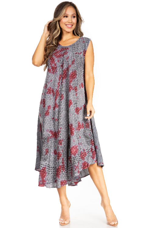 Woman wearing a gray dress with red floral pattern on a white background